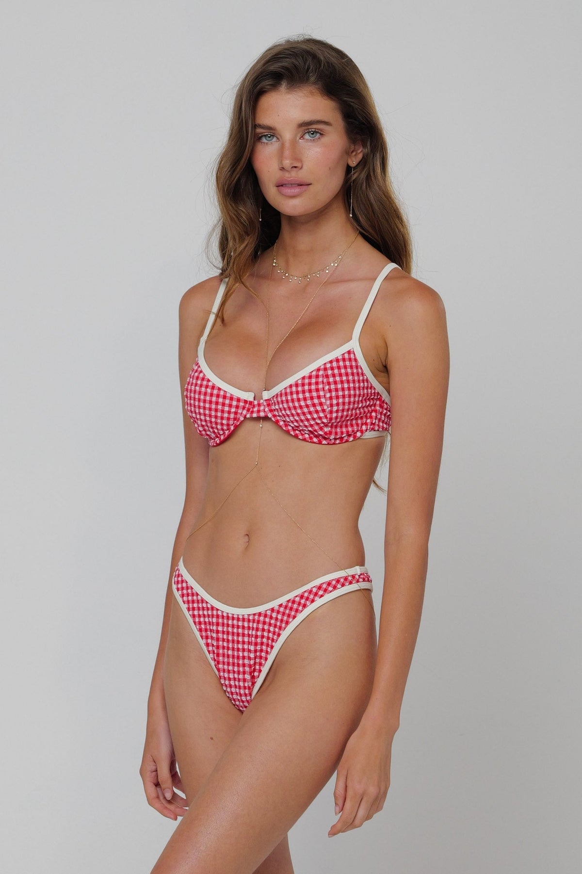 This is an image of Matty Swim Top in Red Gingham - RESA featuring a model wearing the dress