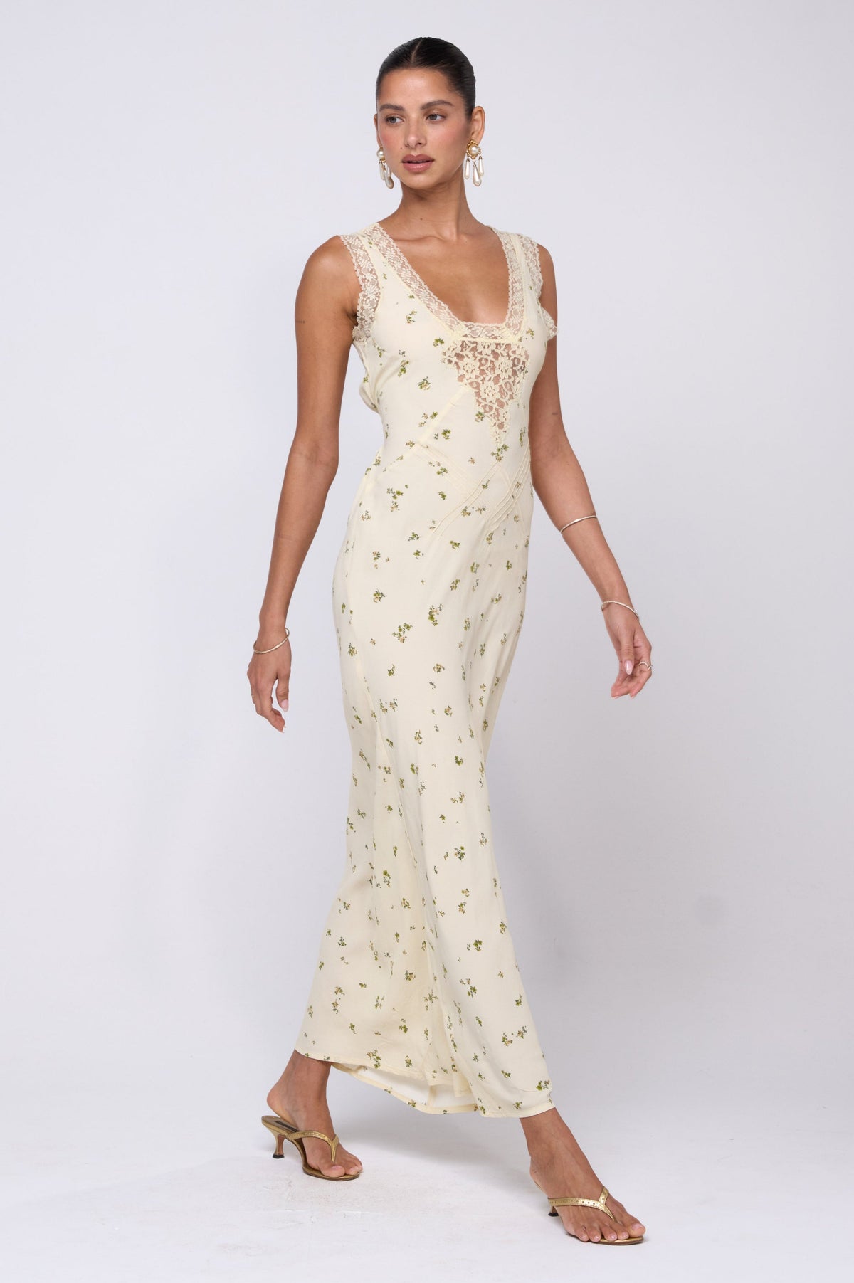 This is an image of Aimee Dress in Beurre - RESA featuring a model wearing the dress