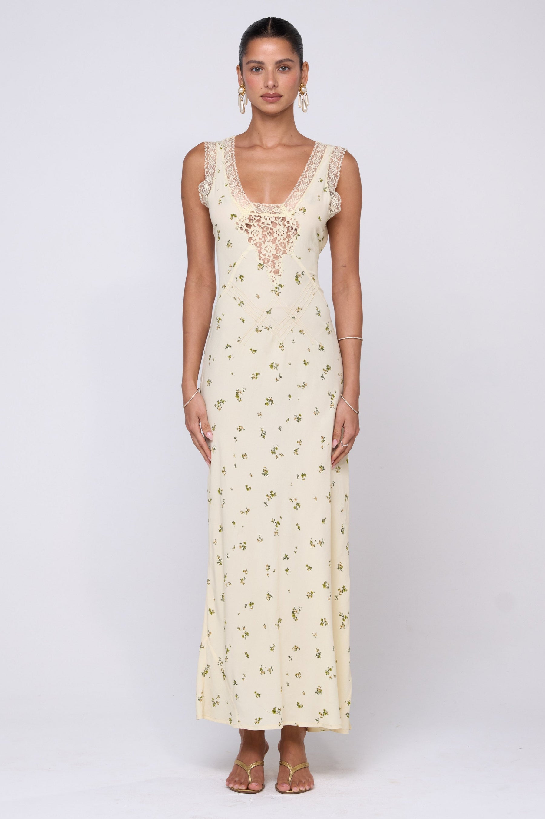 This is an image of Aimee Dress in Beurre - RESA featuring a model wearing the dress