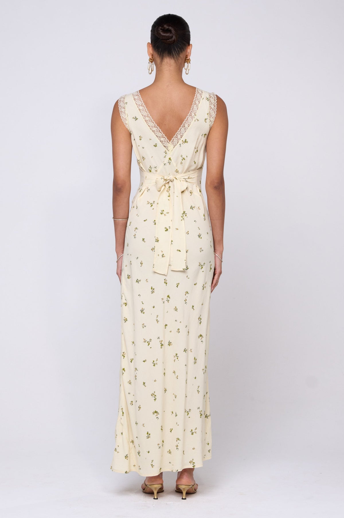 This is an image of Aimee Dress in Beurre - RESA featuring a model wearing the dress