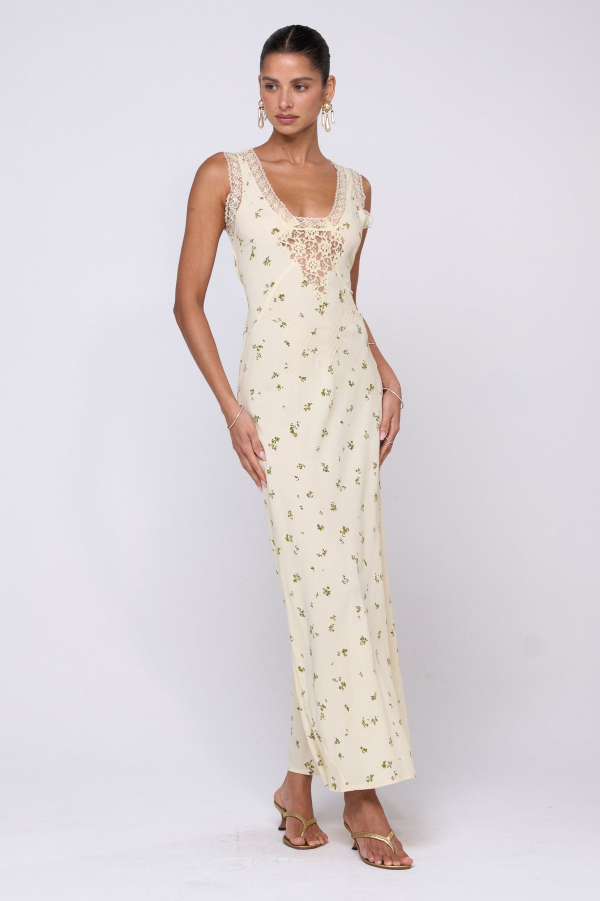 This is an image of Aimee Dress in Beurre - RESA featuring a model wearing the dress