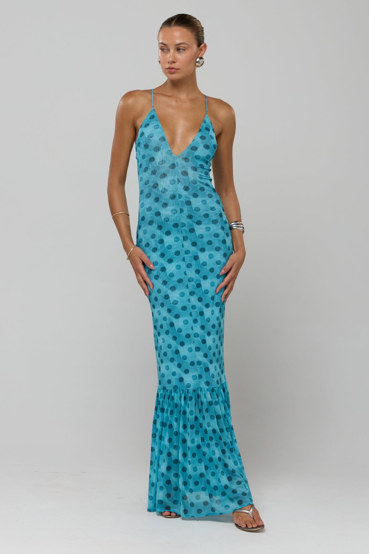 This is an image of Alejandra in Aquamarine - RESA featuring a model wearing the dress