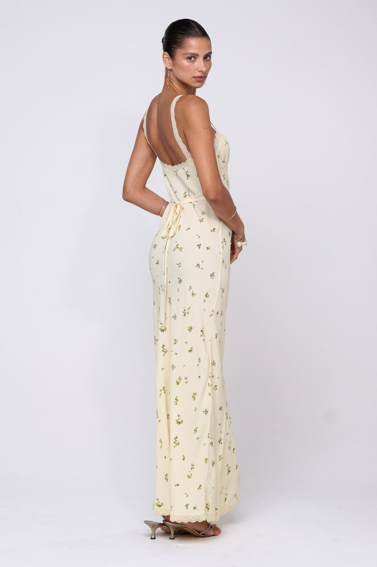 This is an image of Anais Dress in Beurre - RESA featuring a model wearing the dress