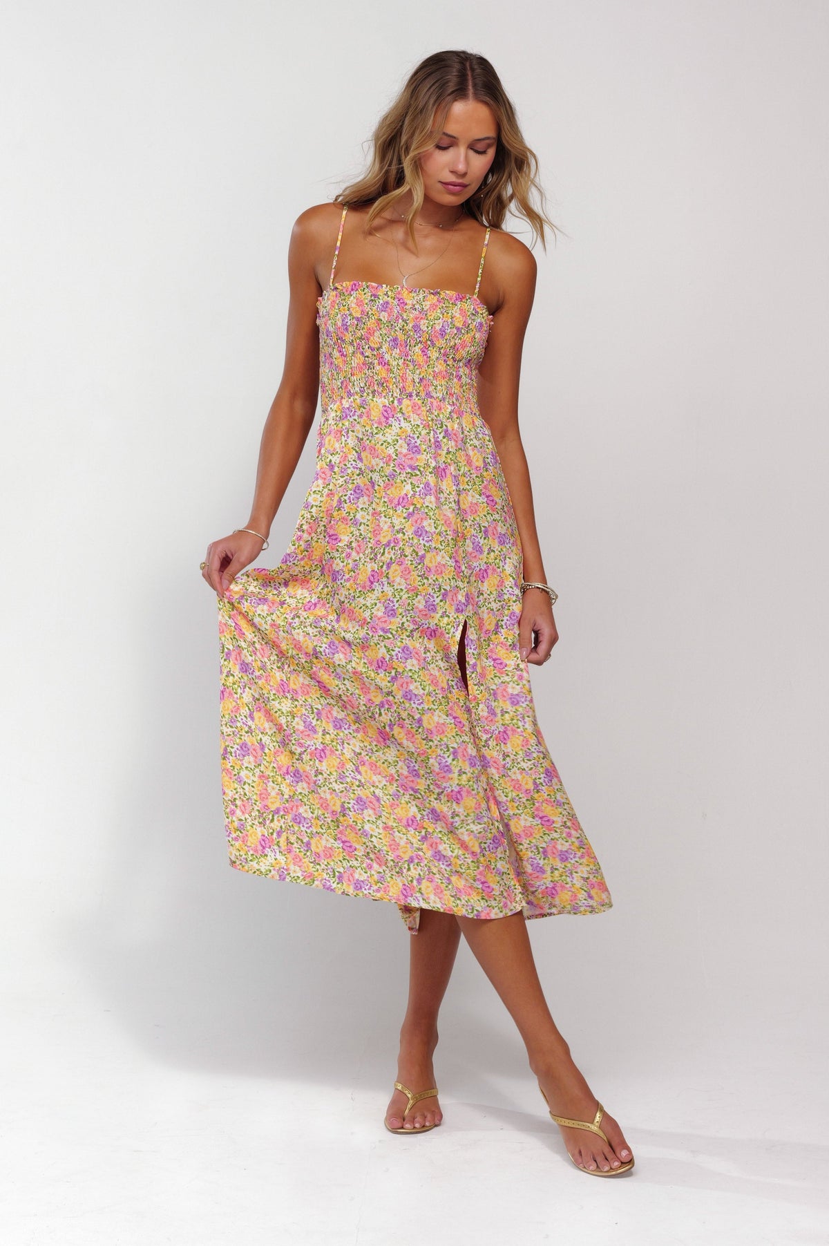 This is an image of Ashley Midi in April - RESA featuring a model wearing the dress