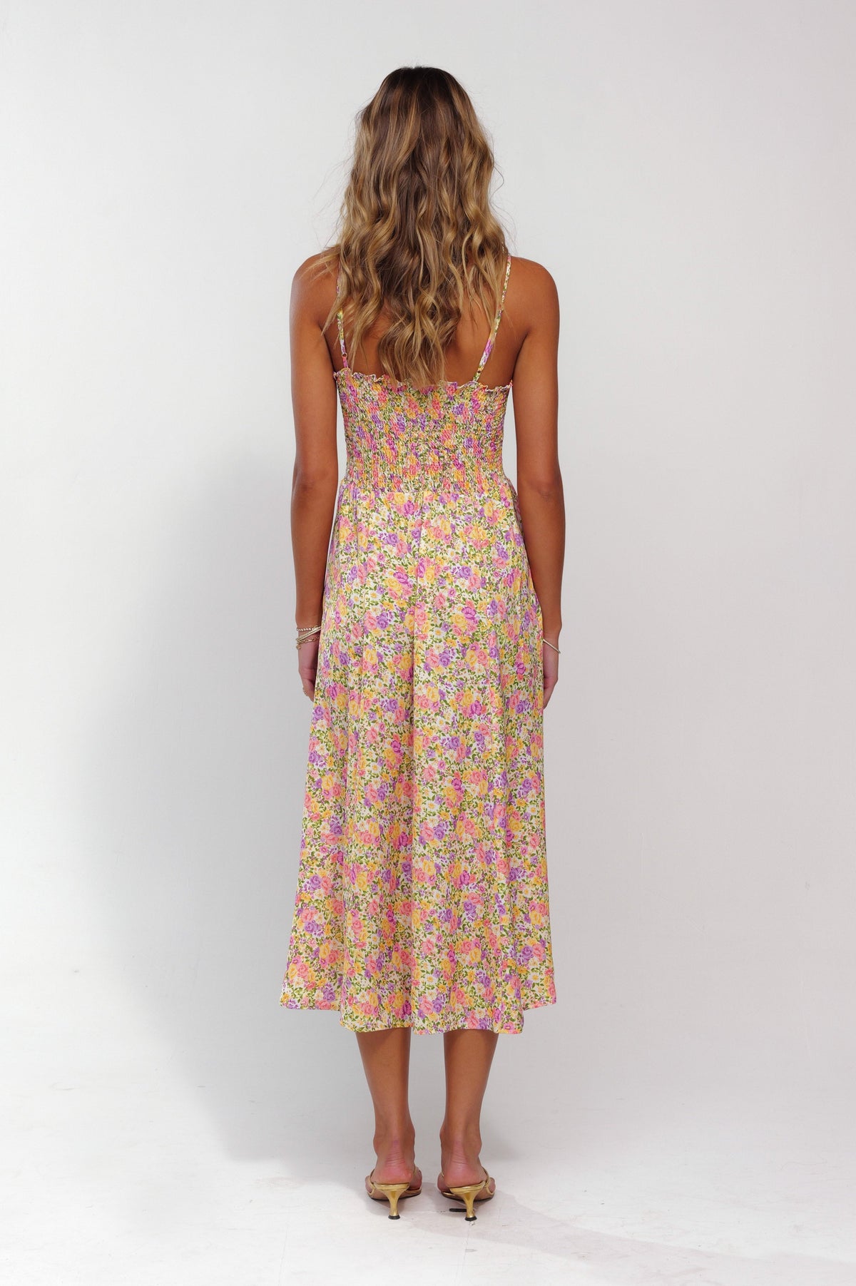 This is an image of Ashley Midi in April - RESA featuring a model wearing the dress