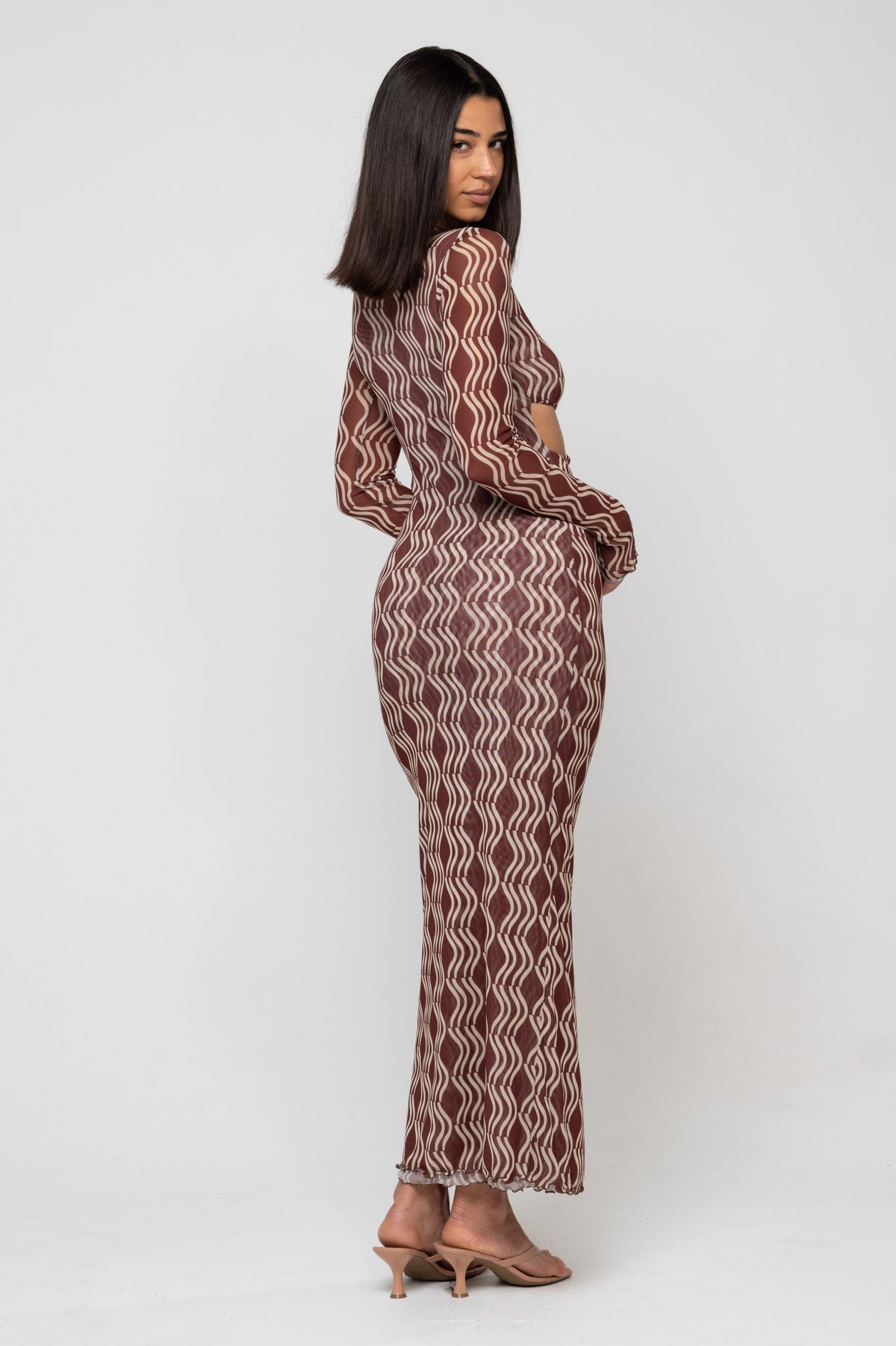 This is an image of Audrey Dress in Coco - RESA featuring a model wearing the dress