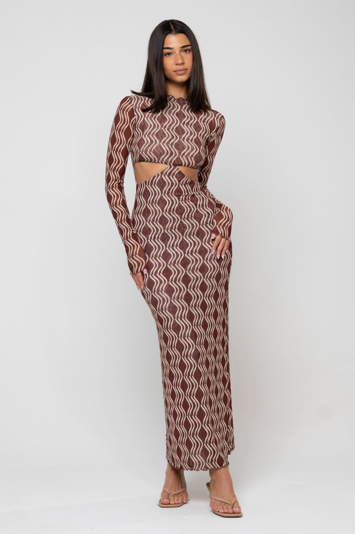 This is an image of Audrey Dress in Coco - RESA featuring a model wearing the dress