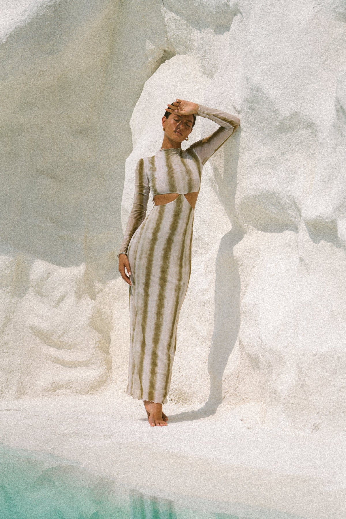 This is an image of Audrey Dress in Dune - RESA featuring a model wearing the dress