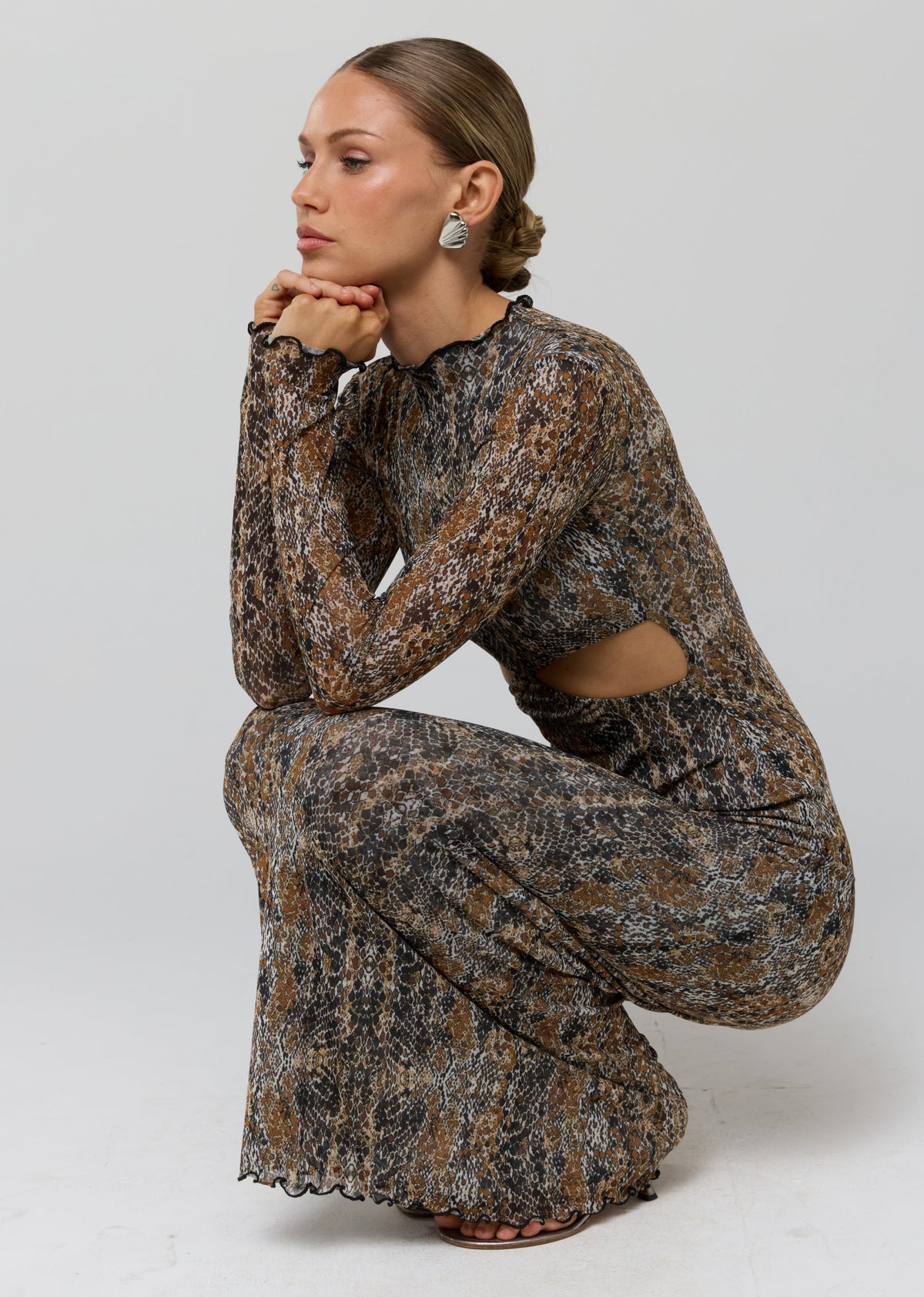 This is an image of Audrey Dress in Serpent - RESA featuring a model wearing the dress
