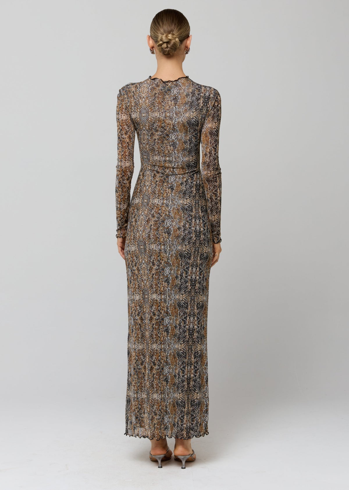 This is an image of Audrey Dress in Serpent - RESA featuring a model wearing the dress