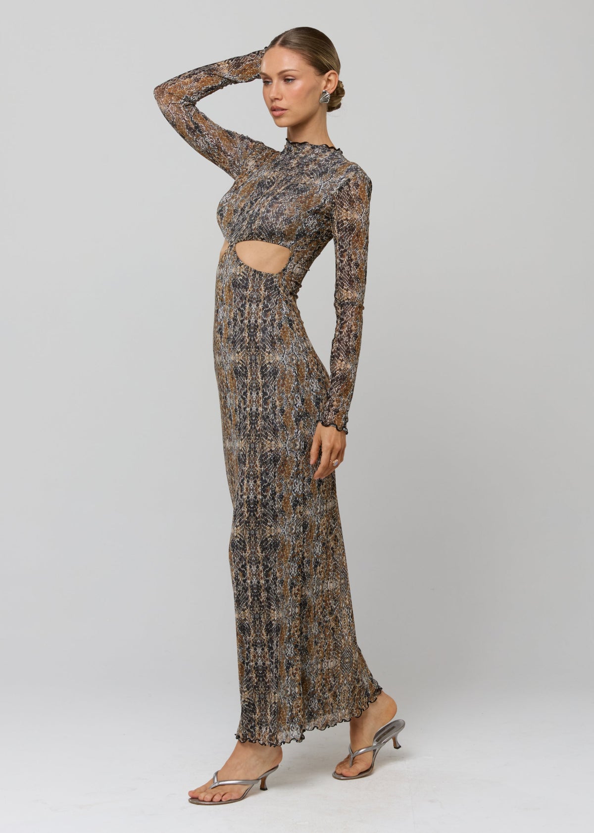 This is an image of Audrey Dress in Serpent - RESA featuring a model wearing the dress