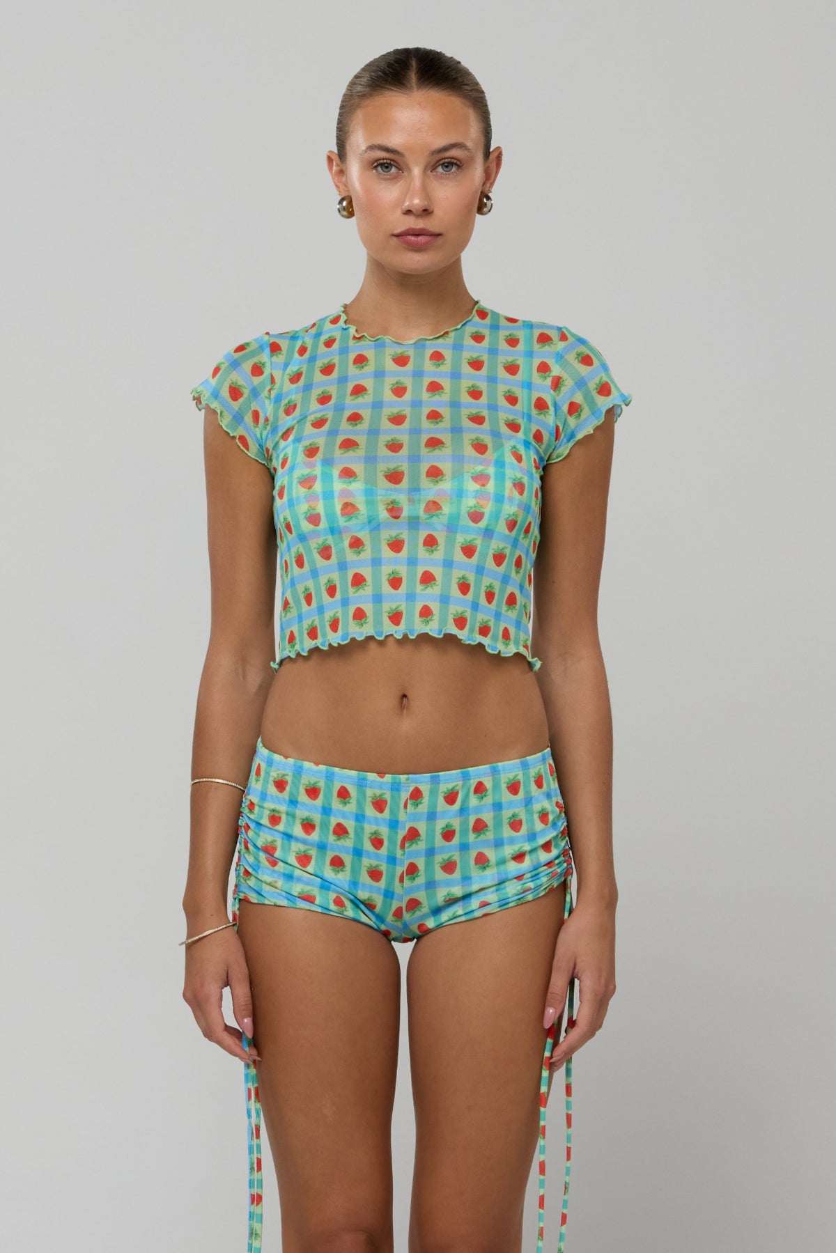 This is an image of Baby Tee Mesh in Juicy - RESA featuring a model wearing the dress