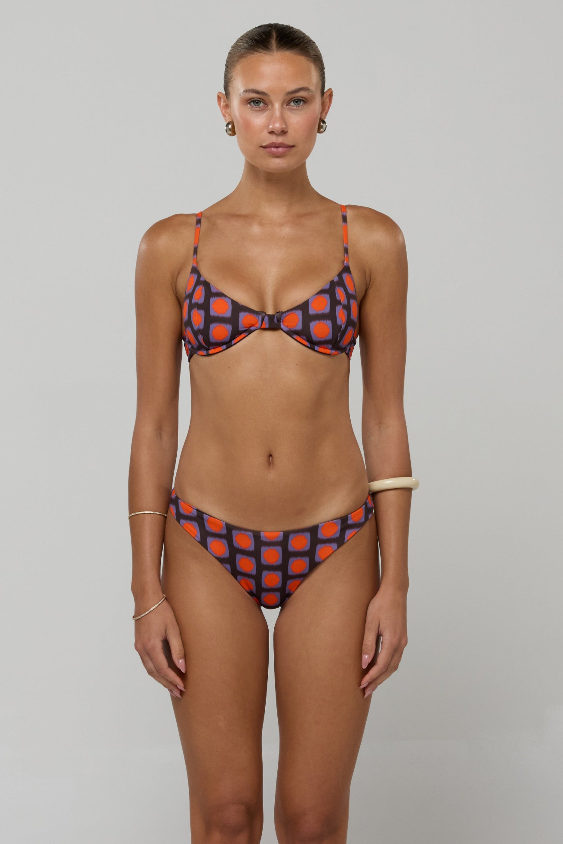 This is an image of Beau Bikini Bottom in Mod - RESA featuring a model wearing the dress