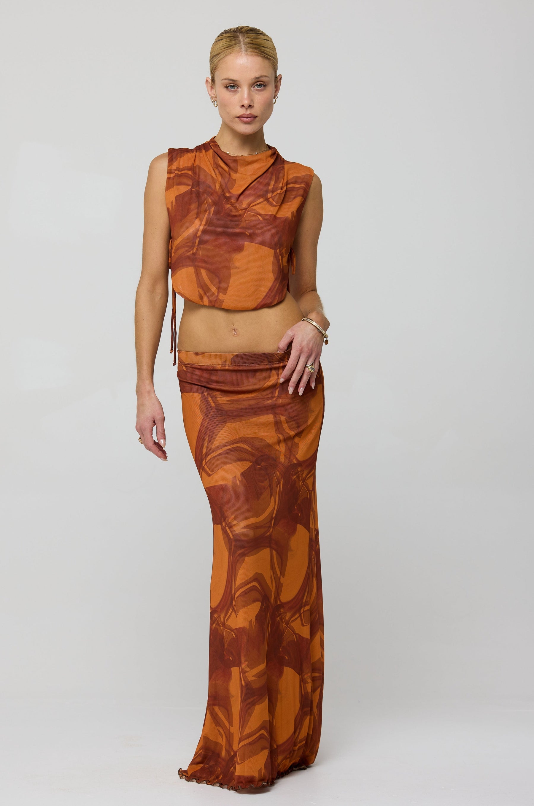 This is an image of Becca Top in Flame - RESA featuring a model wearing the dress