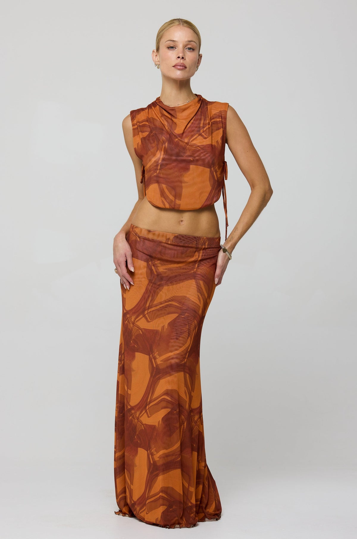 This is an image of Becca Top in Flame - RESA featuring a model wearing the dress