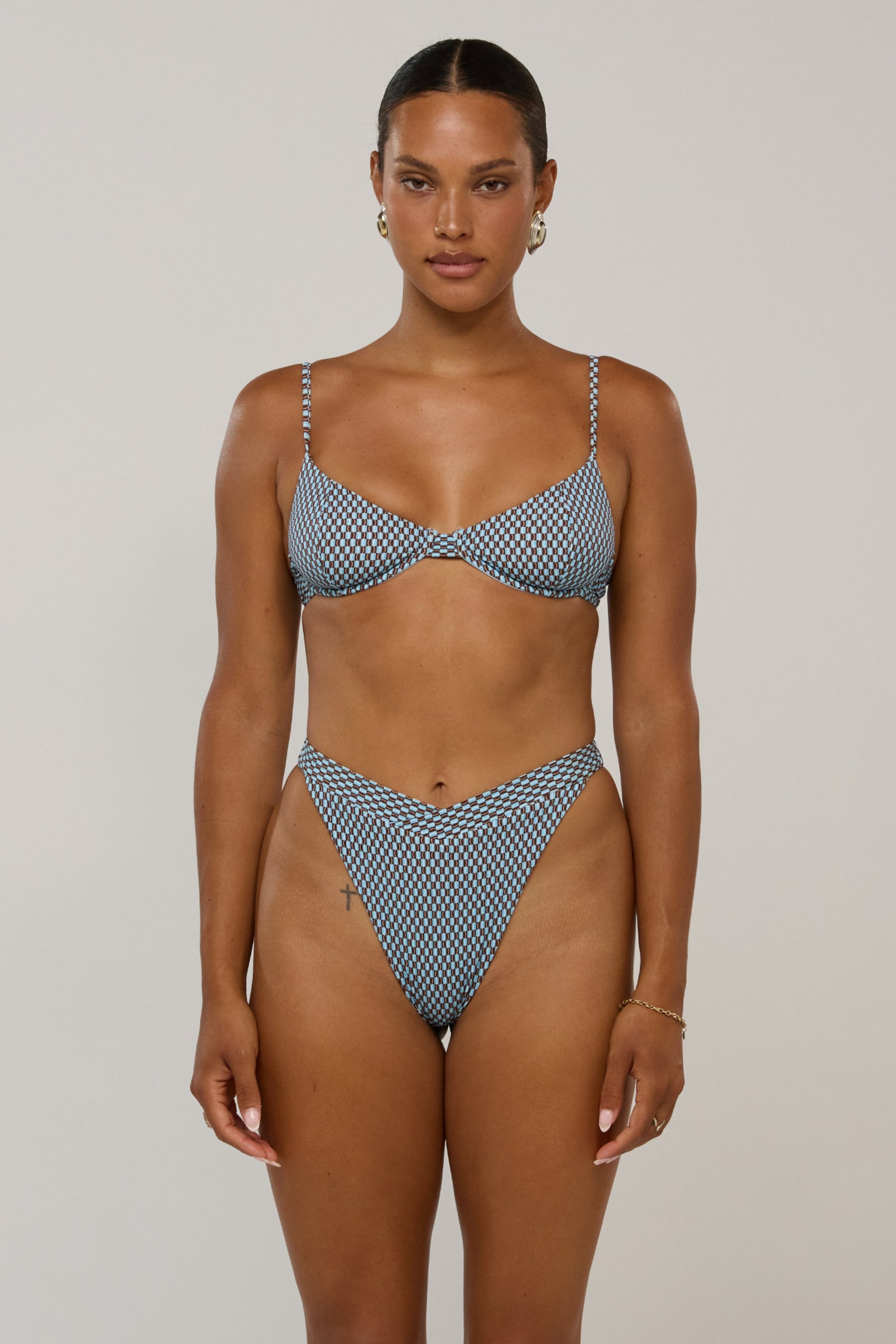 This is an image of Betsy in Swell - RESA featuring a model wearing the dress