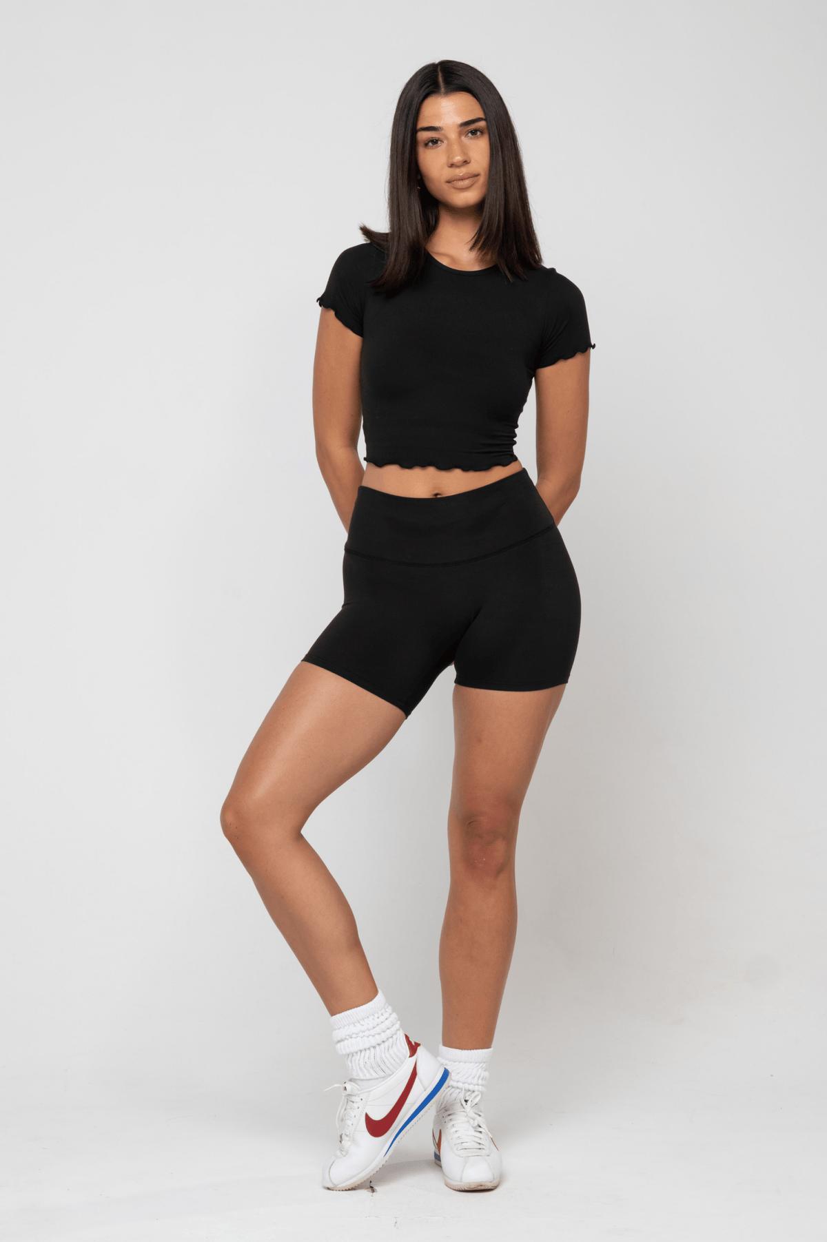 This is an image of Bike Short Second Skin in Black - RESA featuring a model wearing the dress