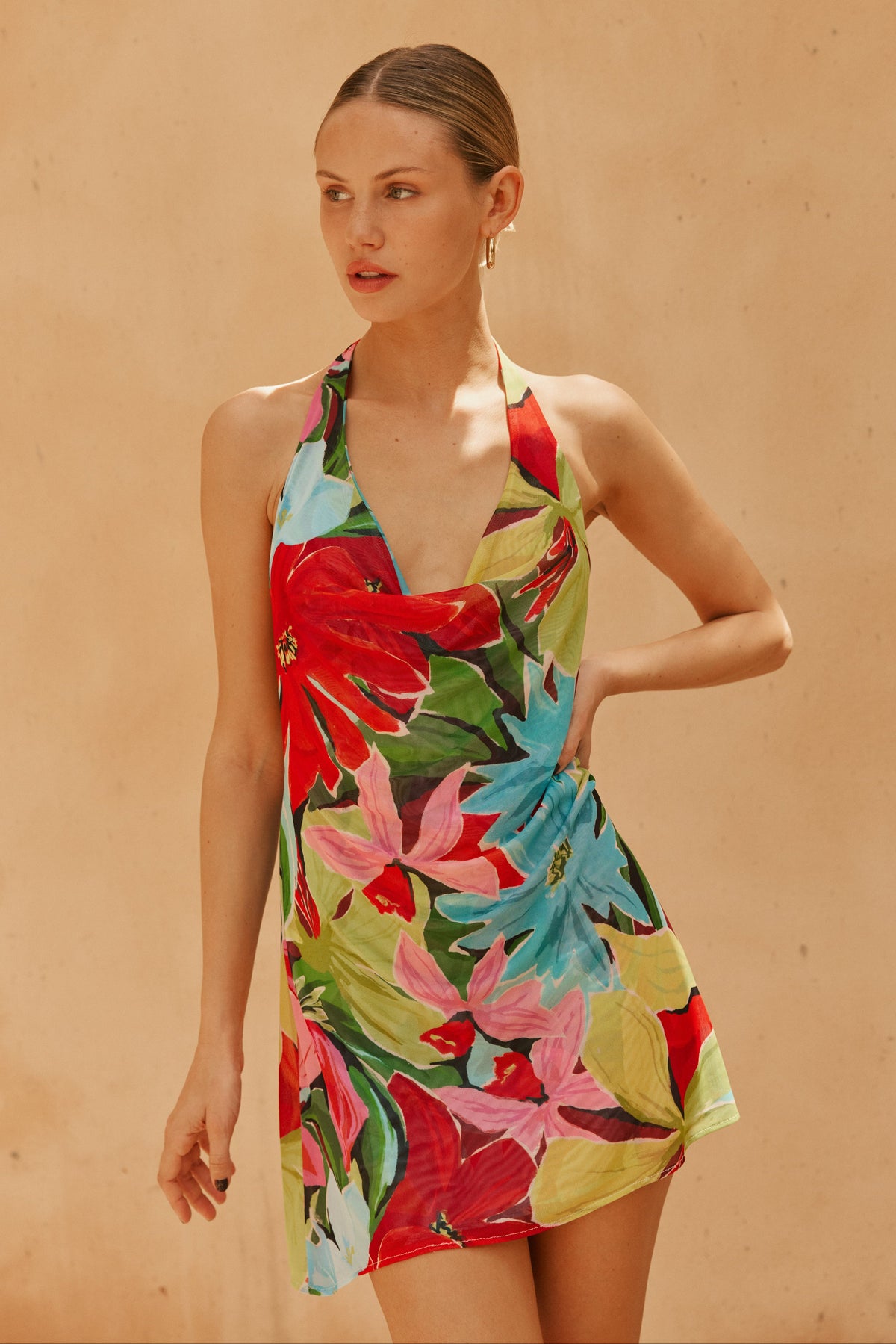 This is an image of Bruna Dress in Tropicana - RESA featuring a model wearing the dress