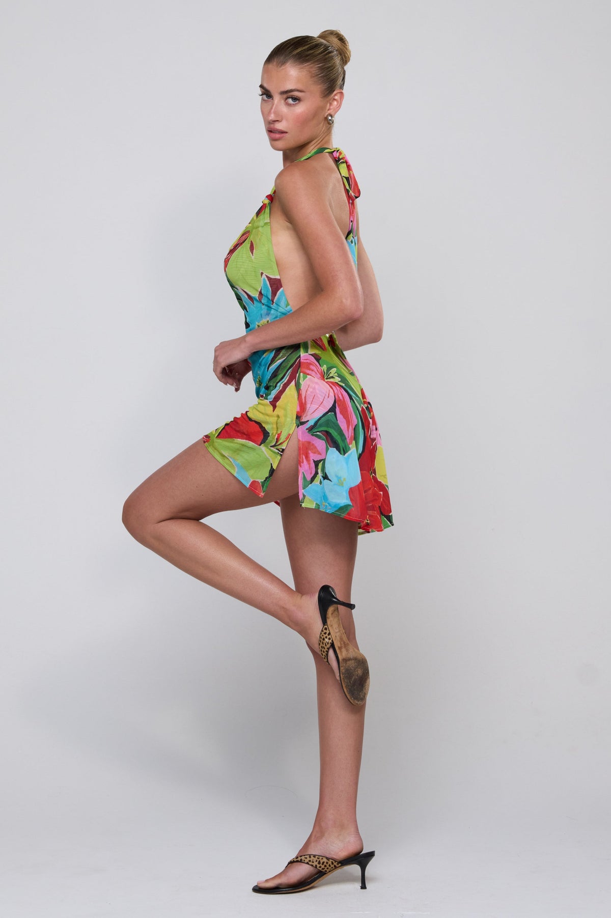 This is an image of Bruna Dress in Tropicana - RESA featuring a model wearing the dress
