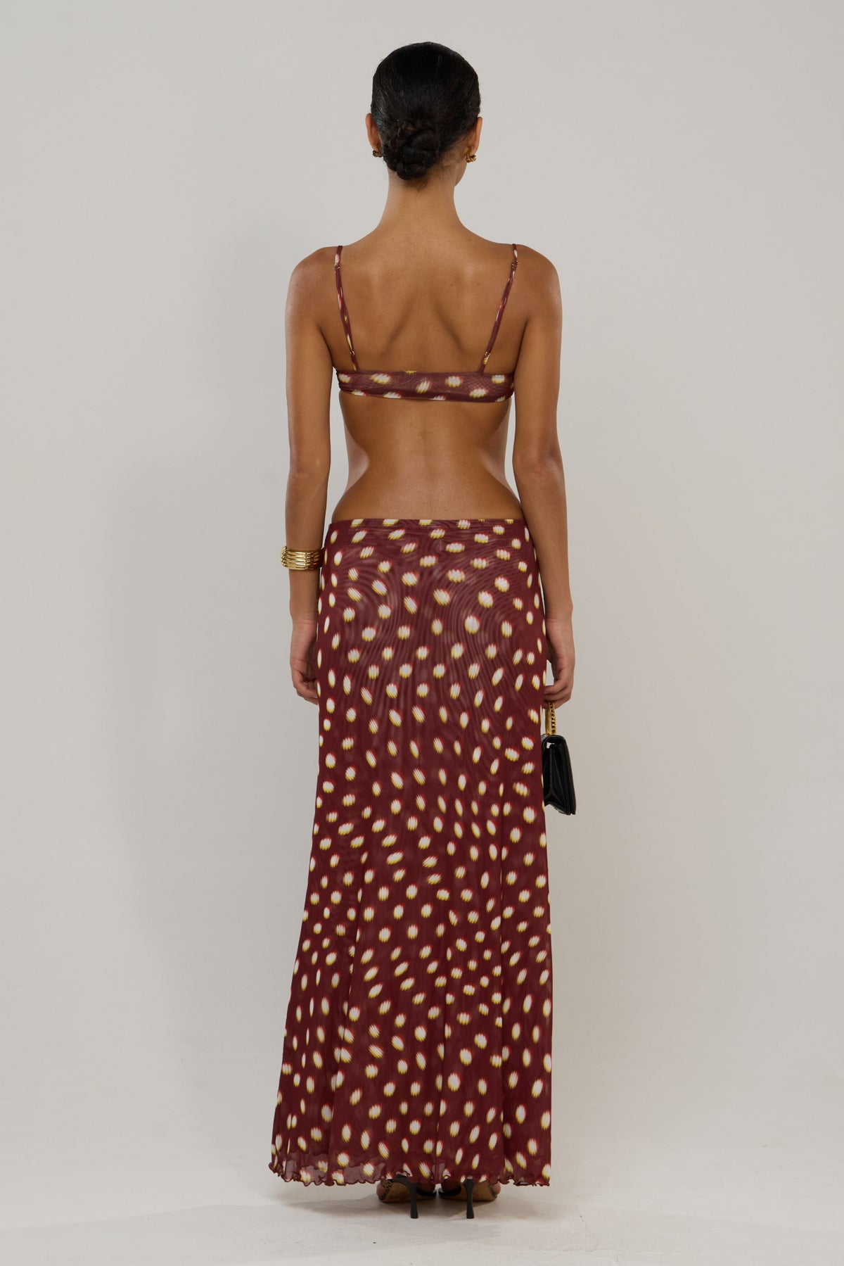 This is an image of Caro in Spice - RESA featuring a model wearing the dress