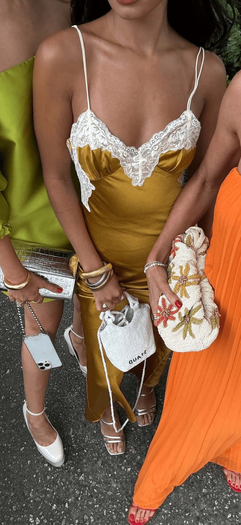 This is an image of Celine Dress in Gold - RESA featuring a model wearing the dress