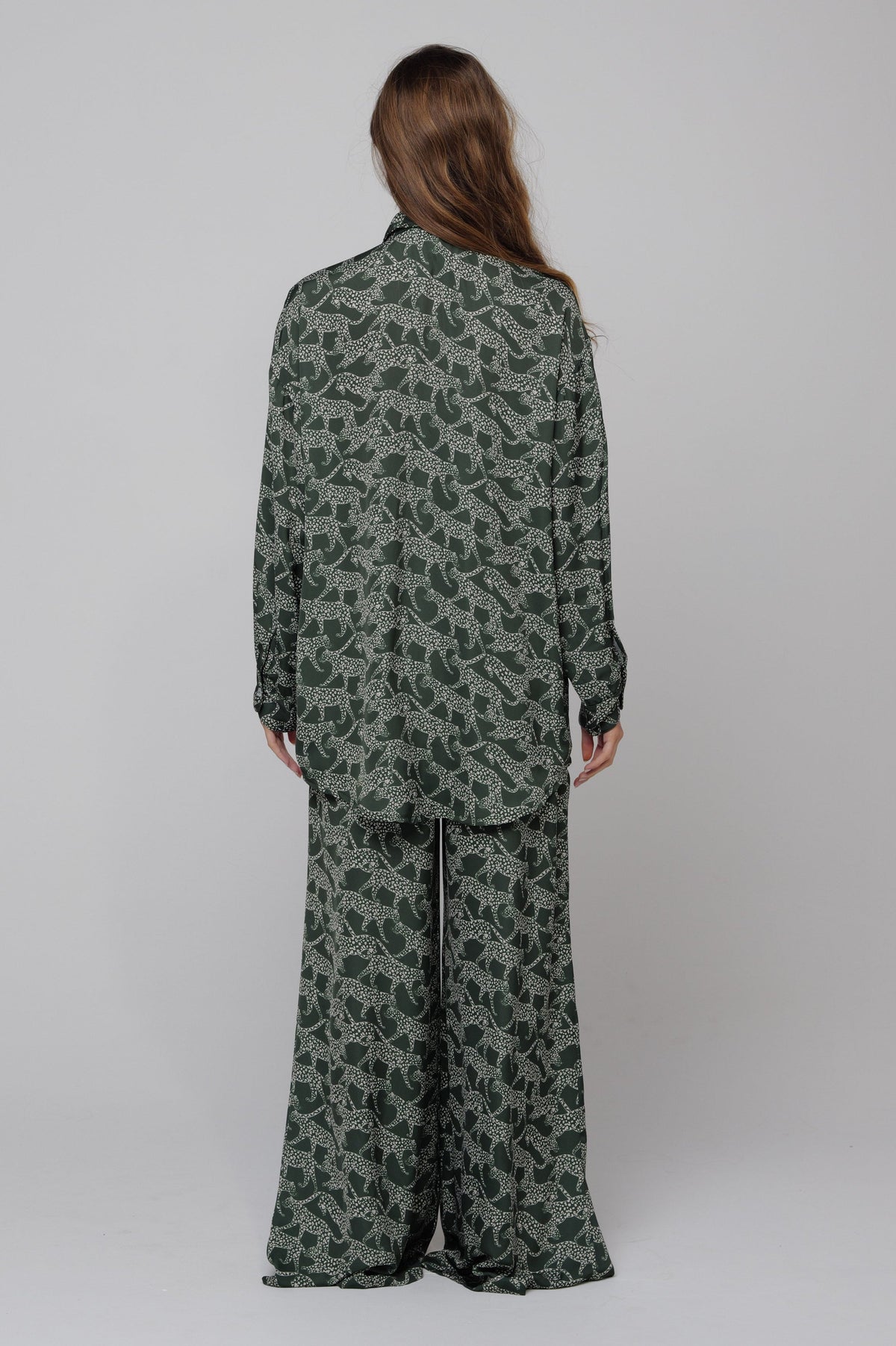 This is an image of Chase Pant in Puma - RESA featuring a model wearing the dress