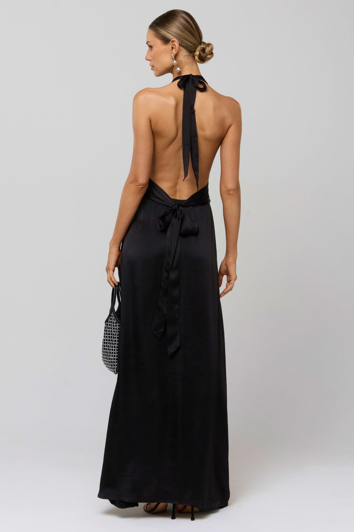 This is an image of Chelsea Dress in Black - RESA featuring a model wearing the dress