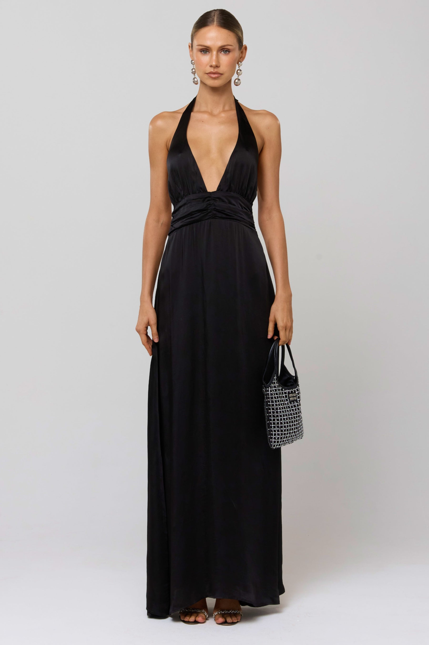 This is an image of Chelsea Dress in Black - RESA featuring a model wearing the dress