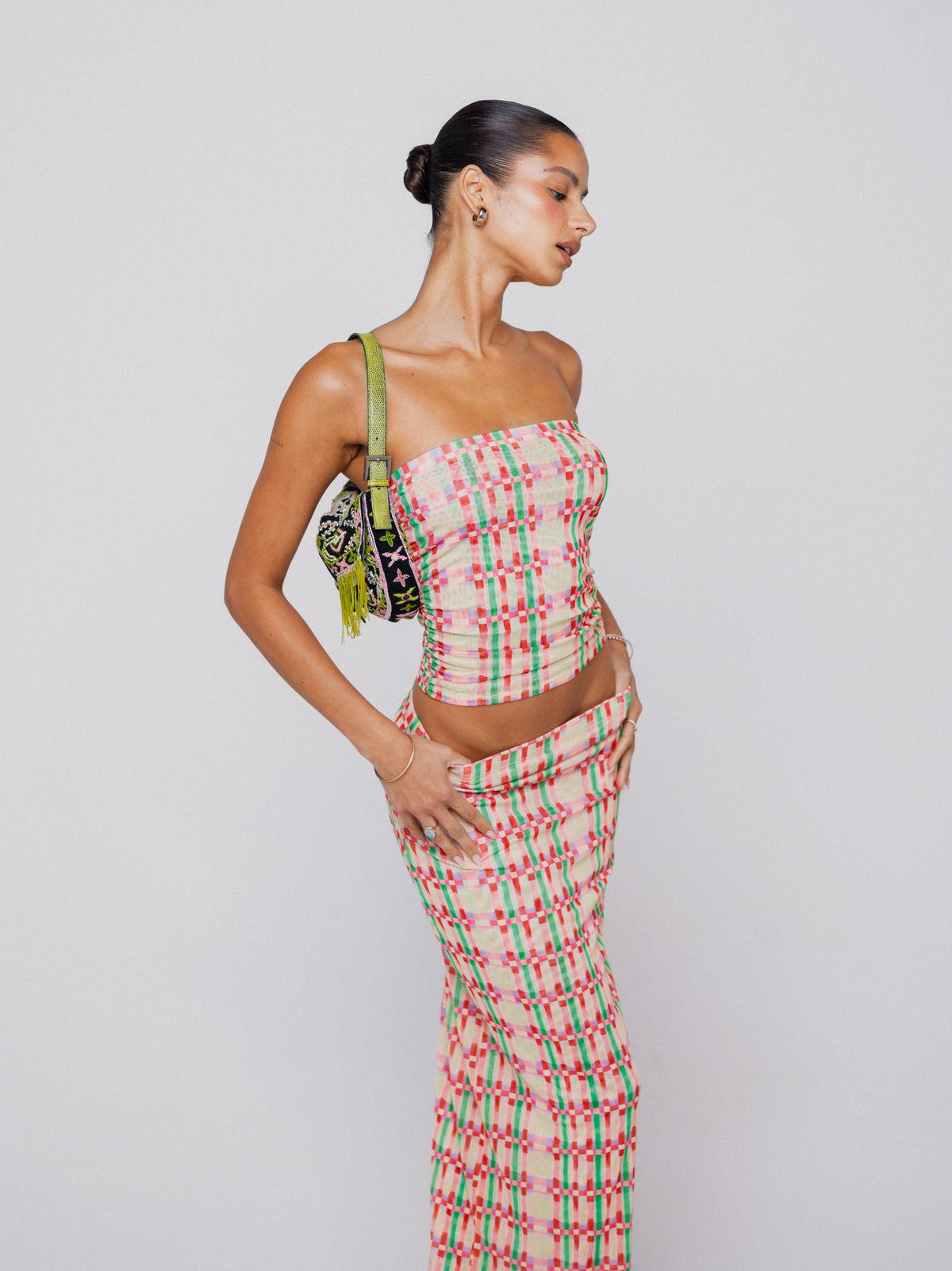 This is an image of Clyde Mesh Skirt in Plaid - RESA featuring a model wearing the dress