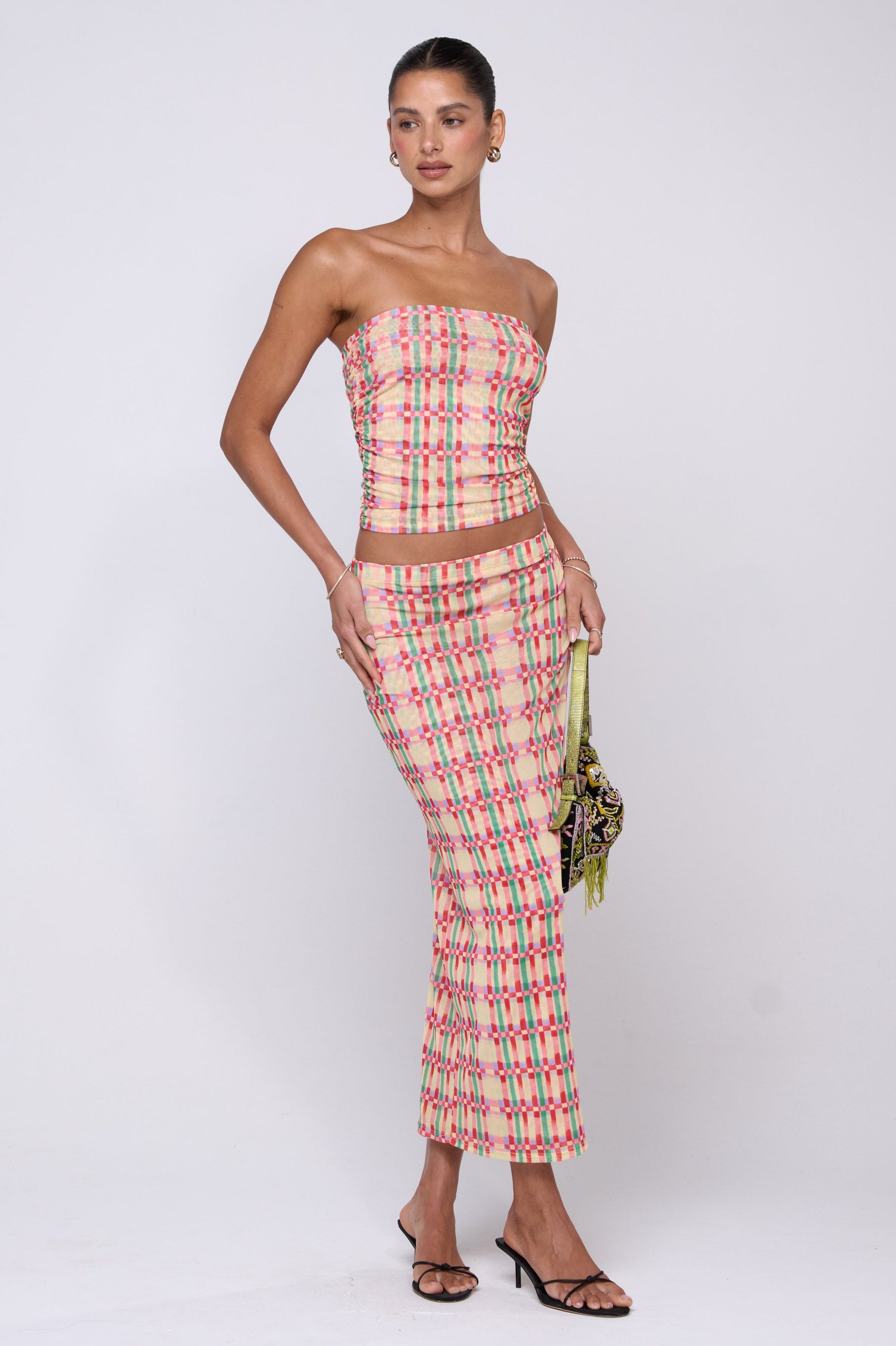 This is an image of Clyde Mesh Skirt in Plaid - RESA featuring a model wearing the dress