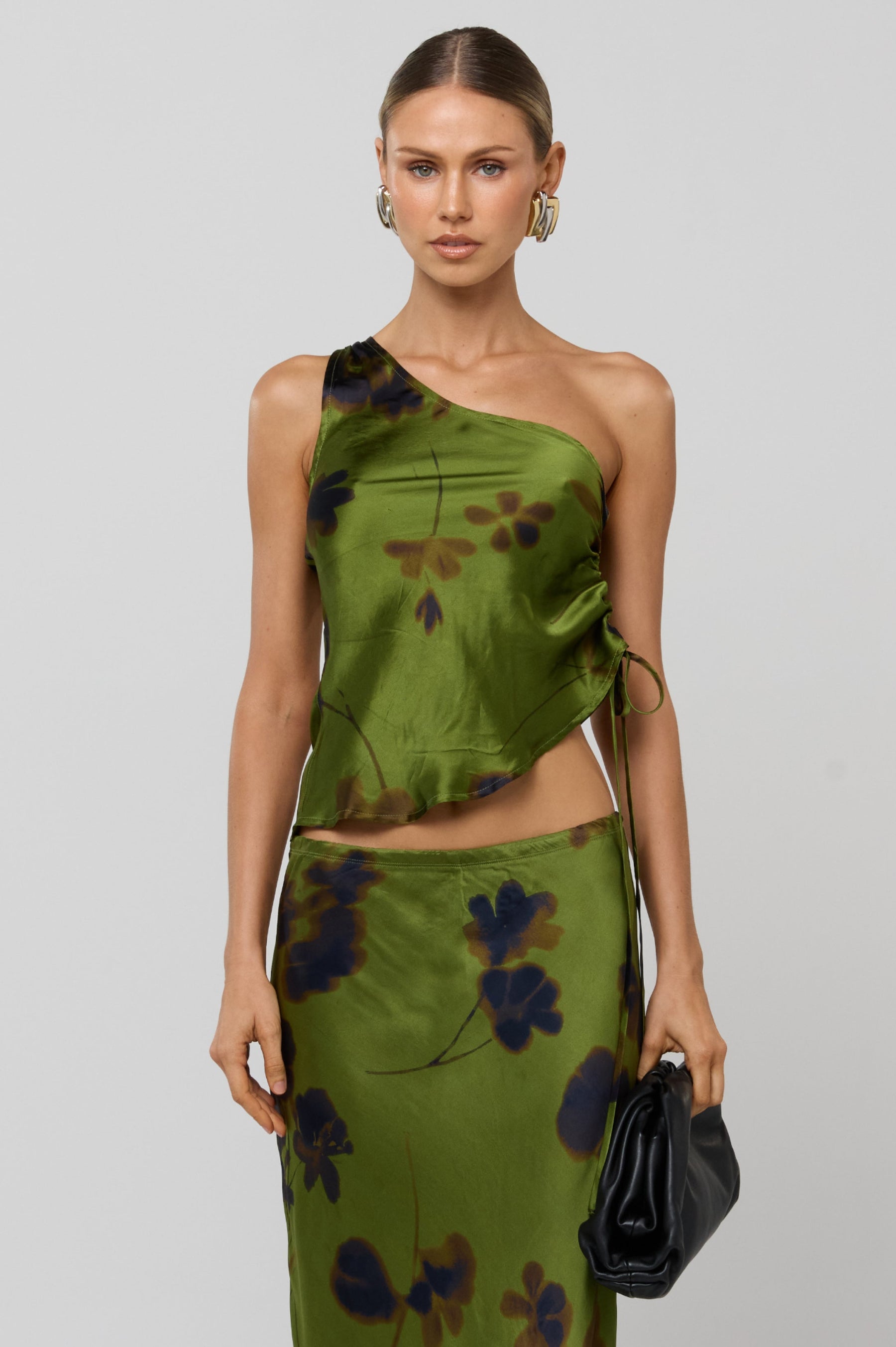 This is an image of Crystal Top in Evergreen - RESA featuring a model wearing the dress