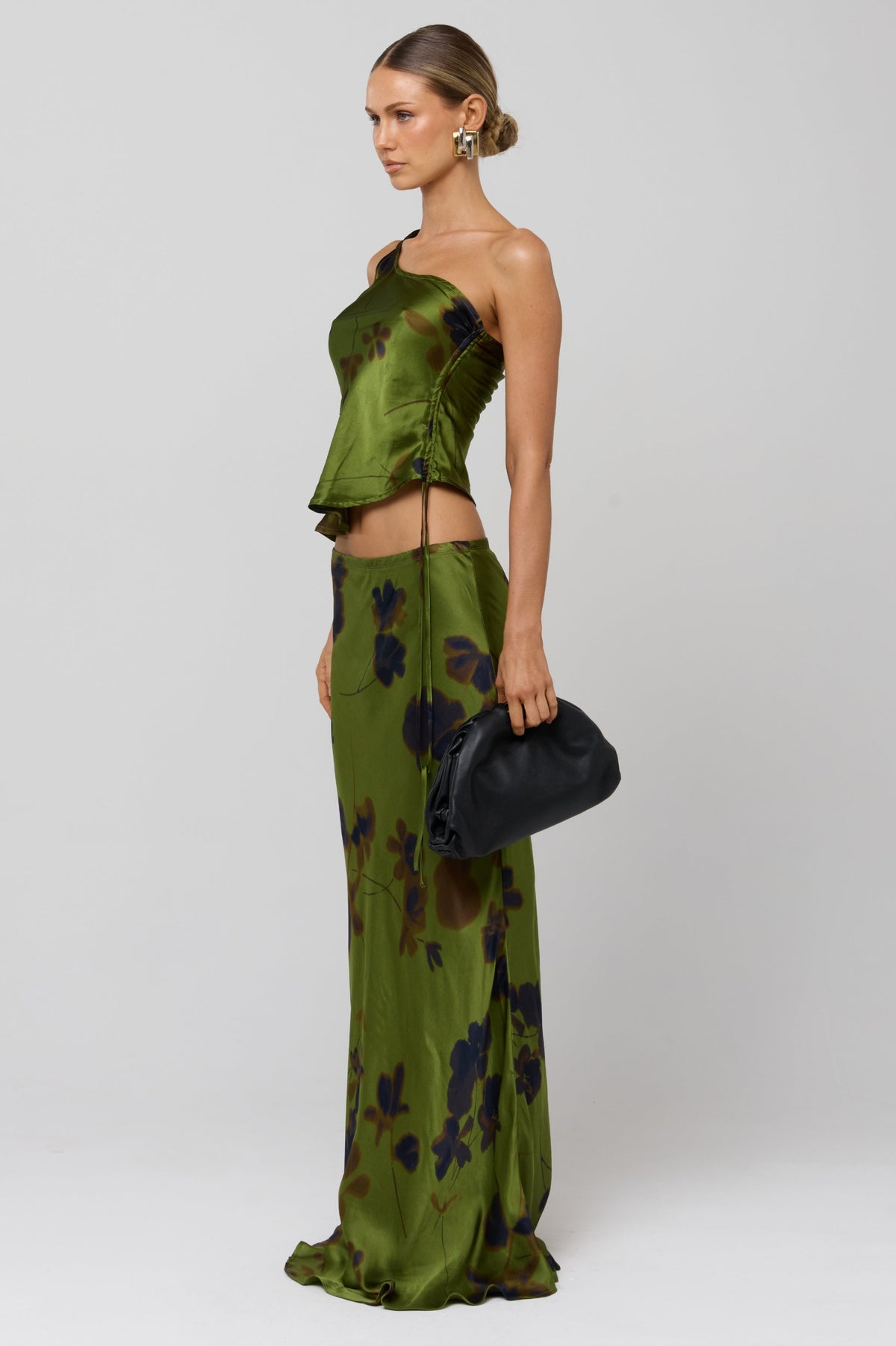 This is an image of Crystal Top in Evergreen - RESA featuring a model wearing the dress