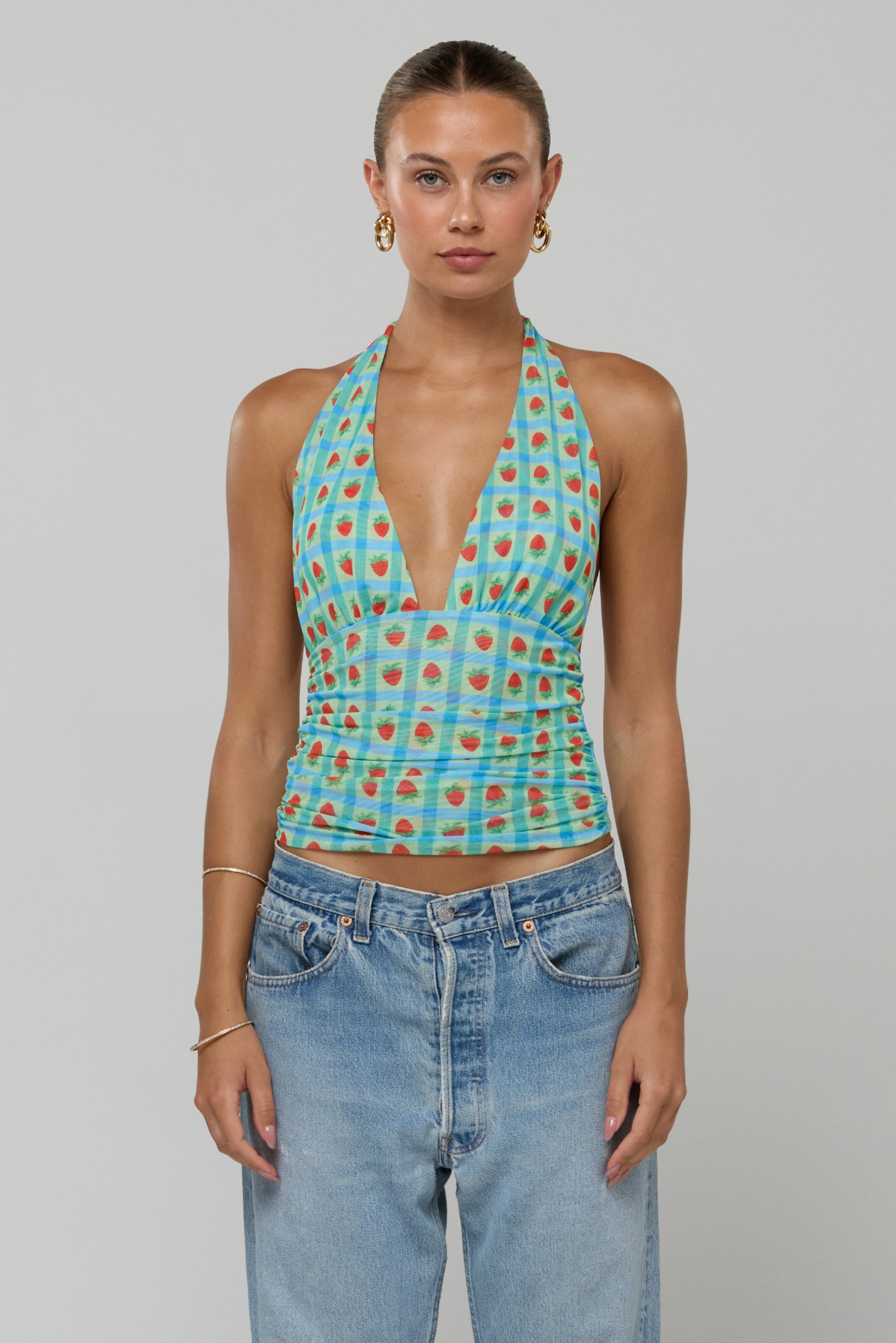 This is an image of Dena Top in Juicy - RESA featuring a model wearing the dress
