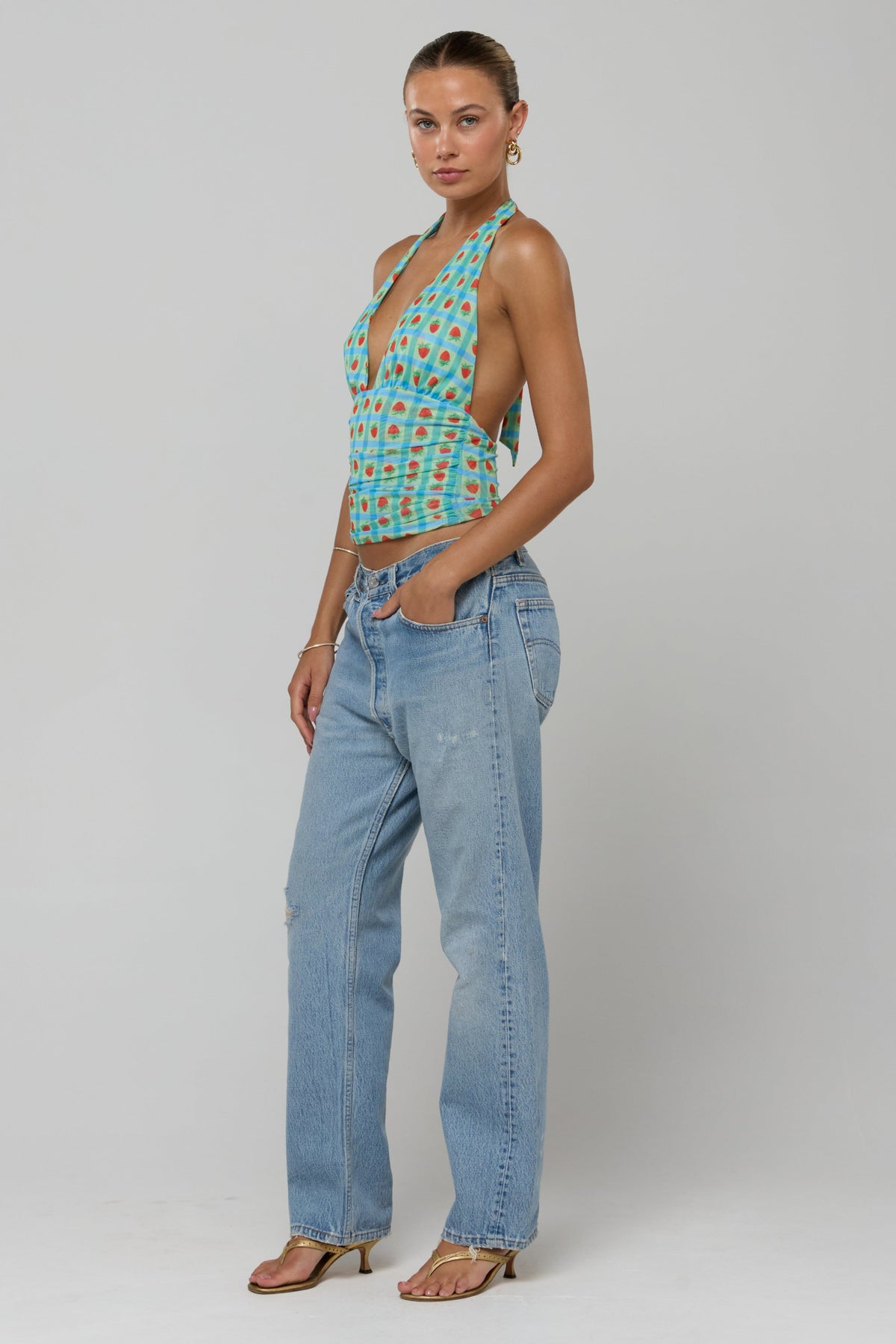 This is an image of Dena Top in Juicy - RESA featuring a model wearing the dress