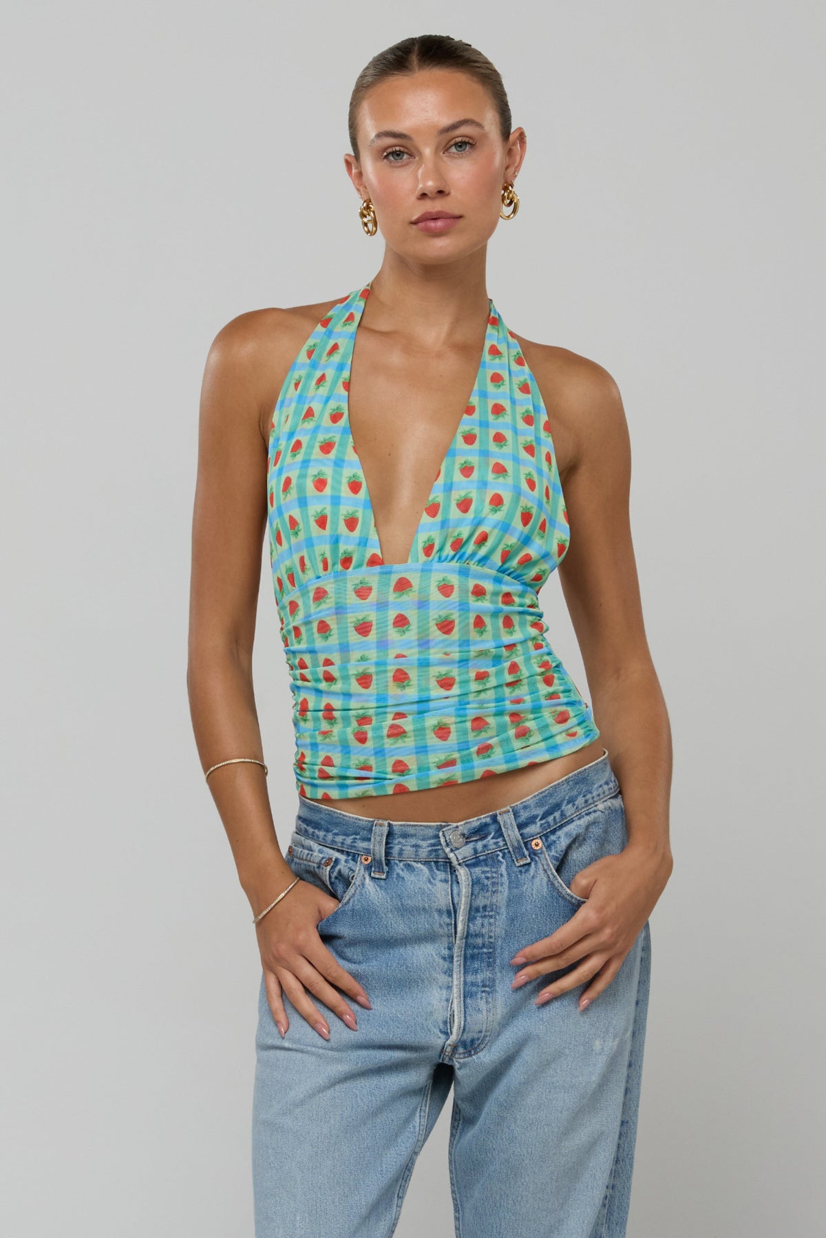 This is an image of Dena Top in Juicy - RESA featuring a model wearing the dress