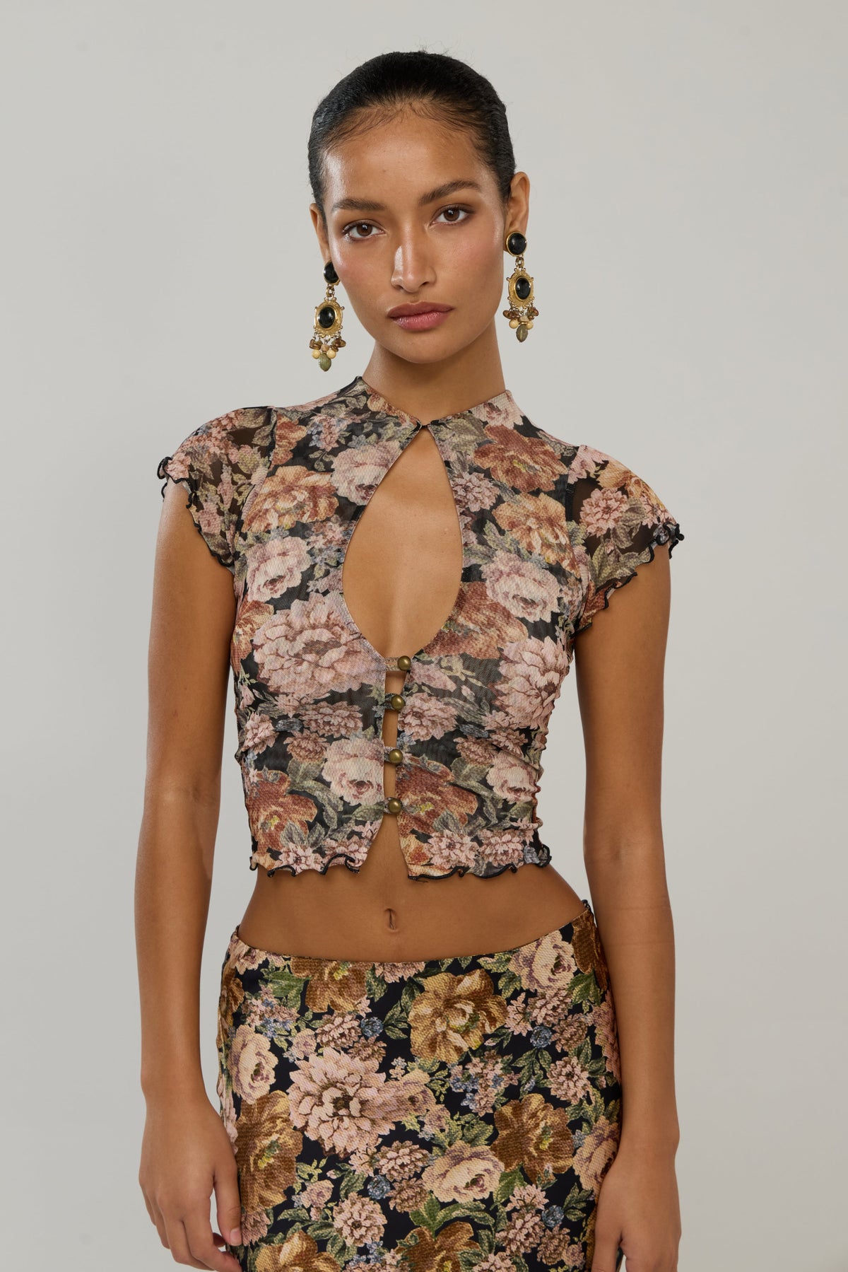 This is an image of Desi in Antique - RESA featuring a model wearing the dress