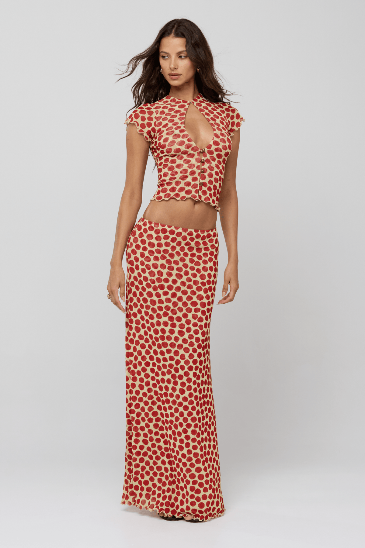 This is an image of Desi Top in Campari - RESA featuring a model wearing the dress