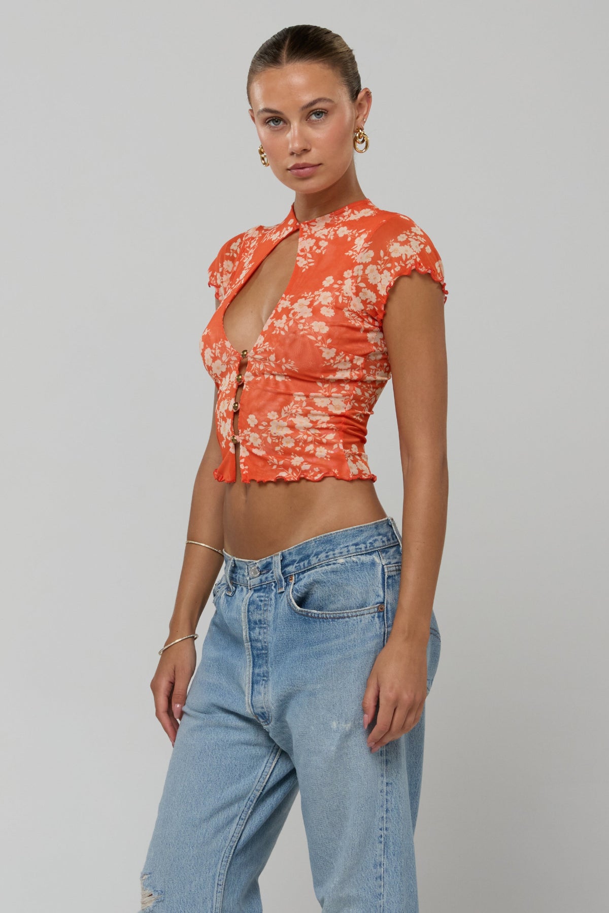 This is an image of Desi Top Orange Blossom - RESA featuring a model wearing the dress