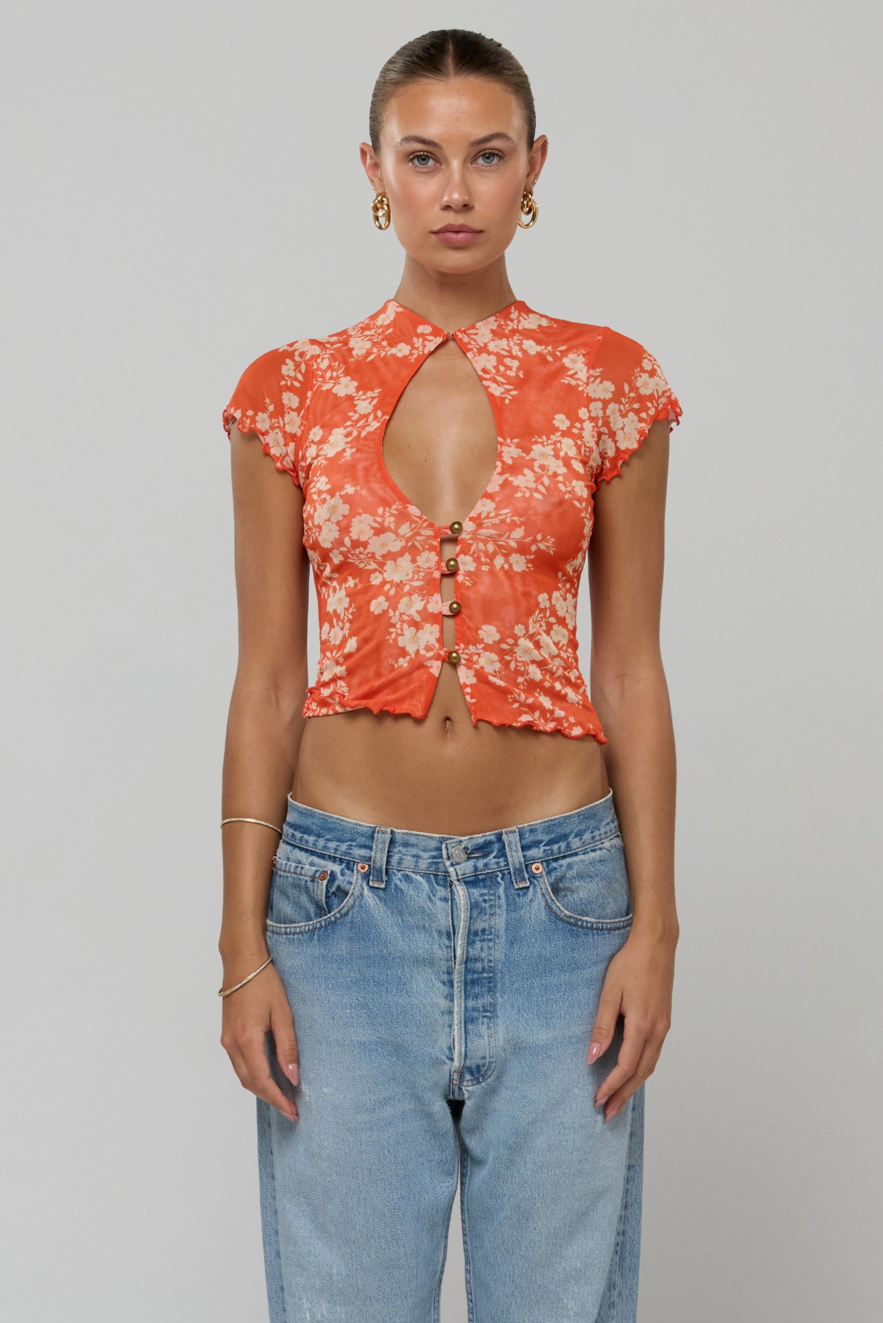 This is an image of Desi Top Orange Blossom - RESA featuring a model wearing the dress