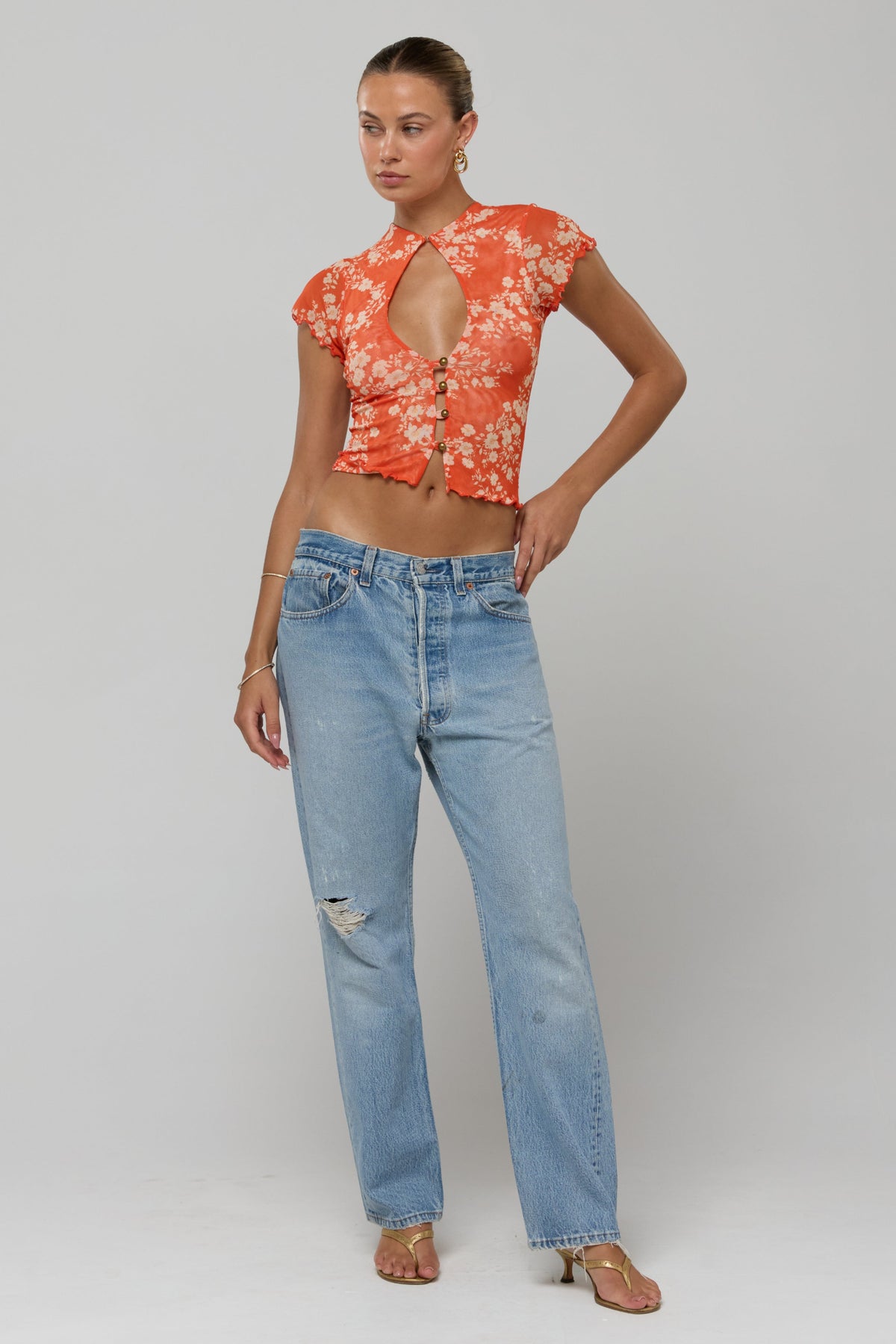 This is an image of Desi Top Orange Blossom - RESA featuring a model wearing the dress