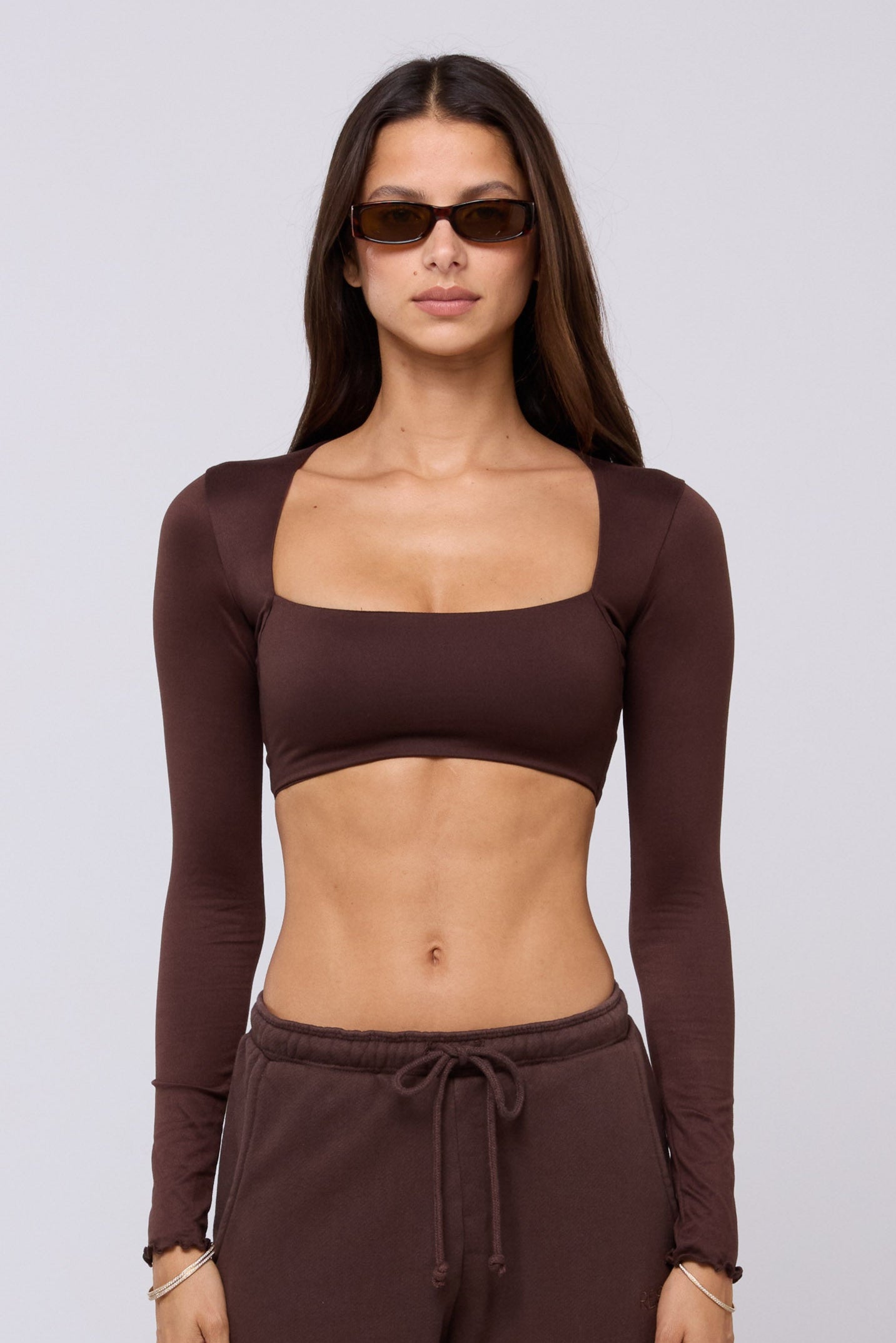 This is an image of Emily Top in Chocolate - RESA featuring a model wearing the dress