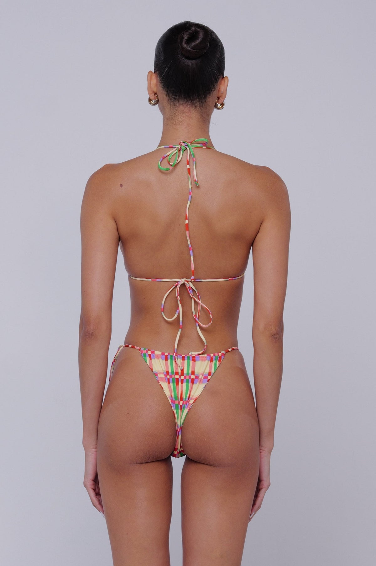 This is an image of Ernie Bikini Bottom in Plaid - RESA featuring a model wearing the dress
