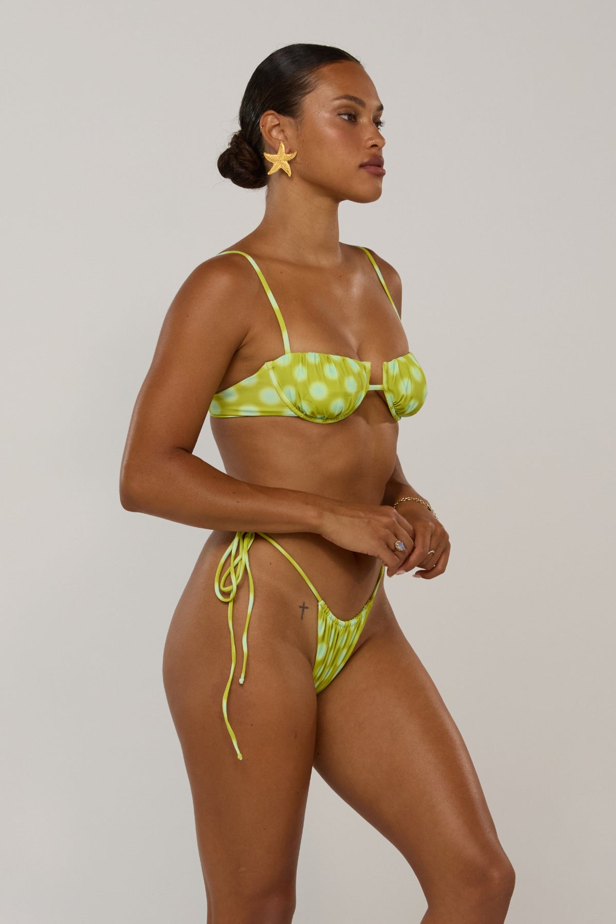 This is an image of Ernie in Luma - RESA featuring a model wearing the dress