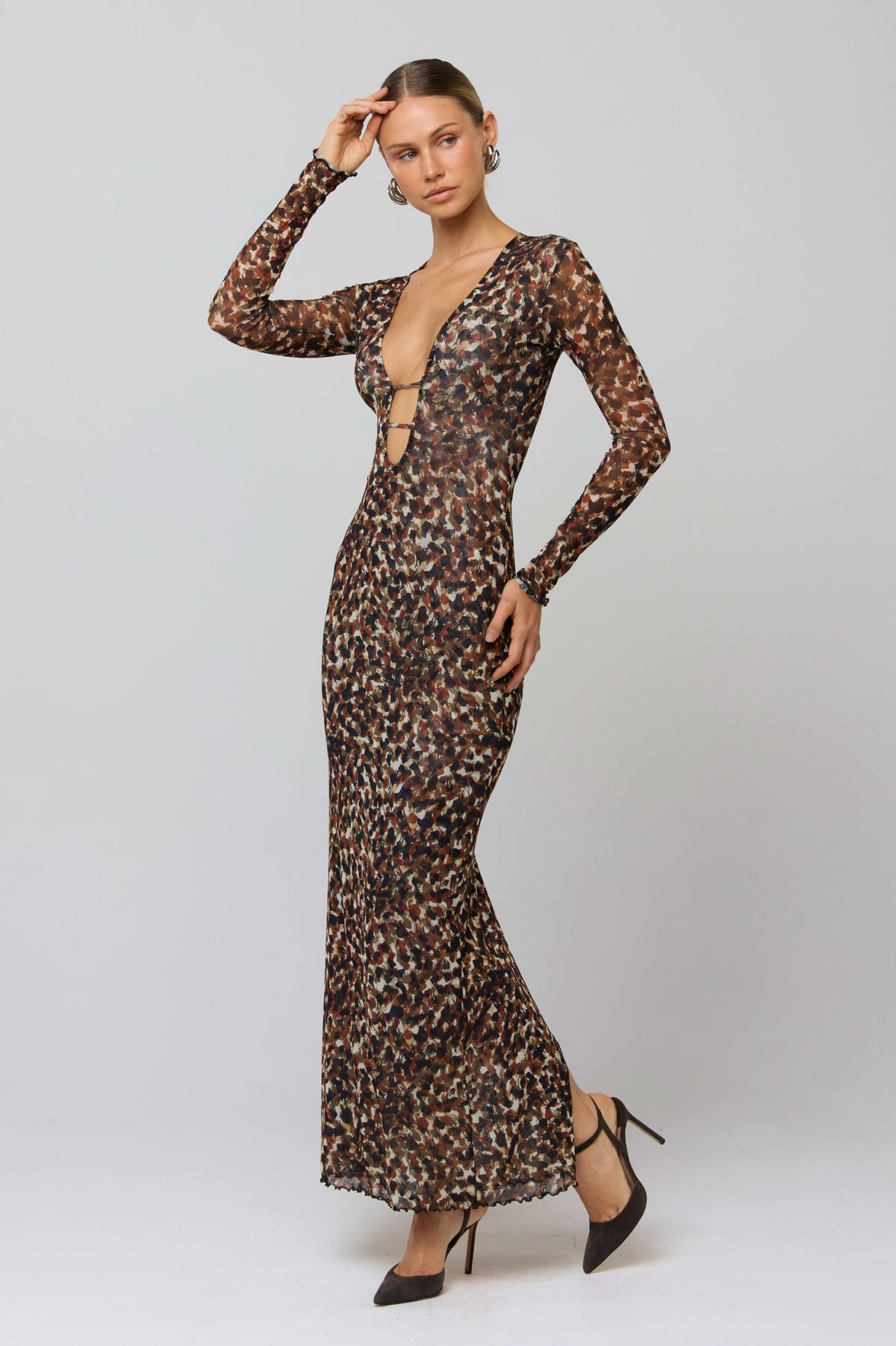 This is an image of Esme Dress in Terra - RESA featuring a model wearing the dress