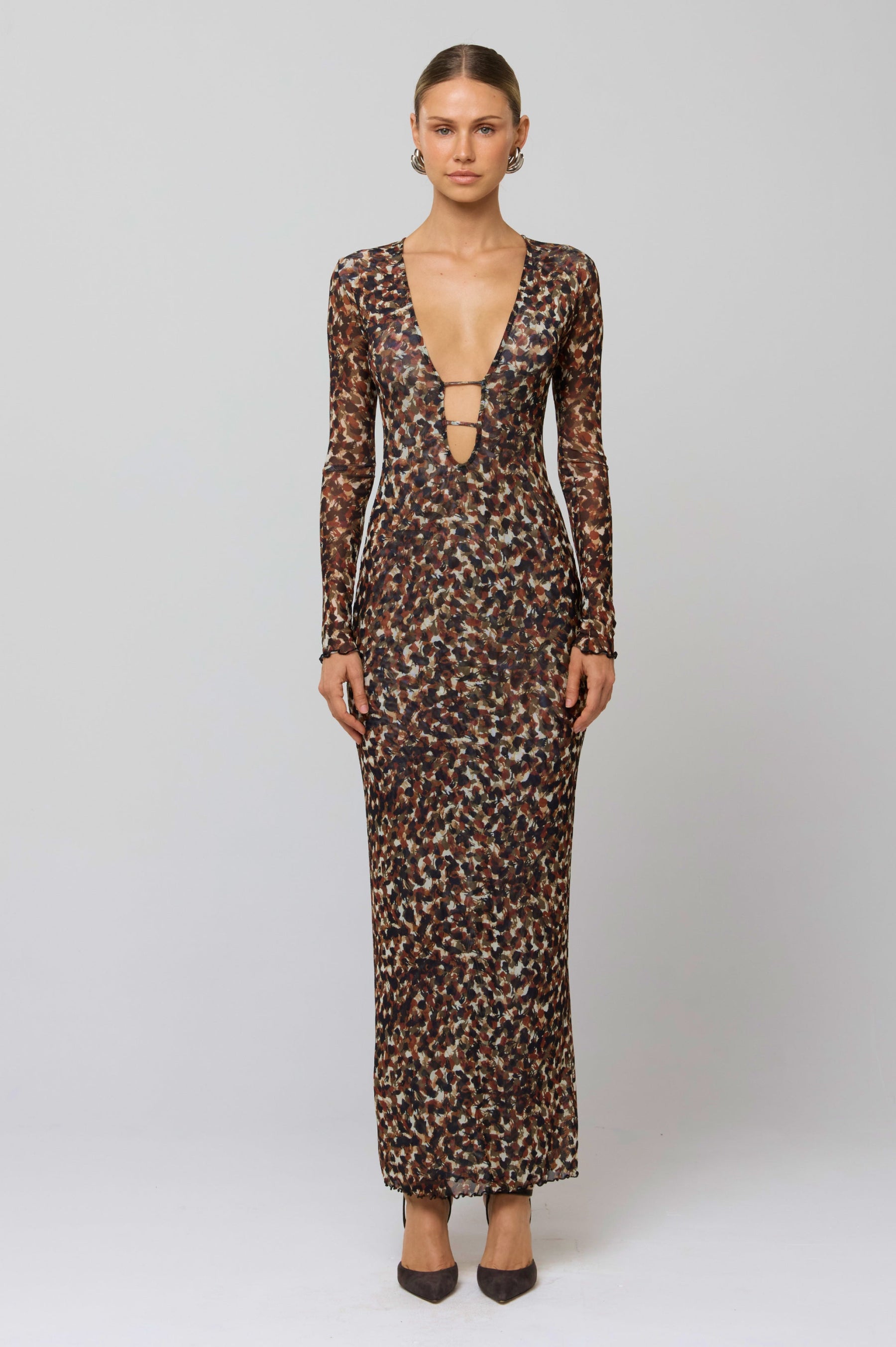 This is an image of Esme Dress in Terra - RESA featuring a model wearing the dress