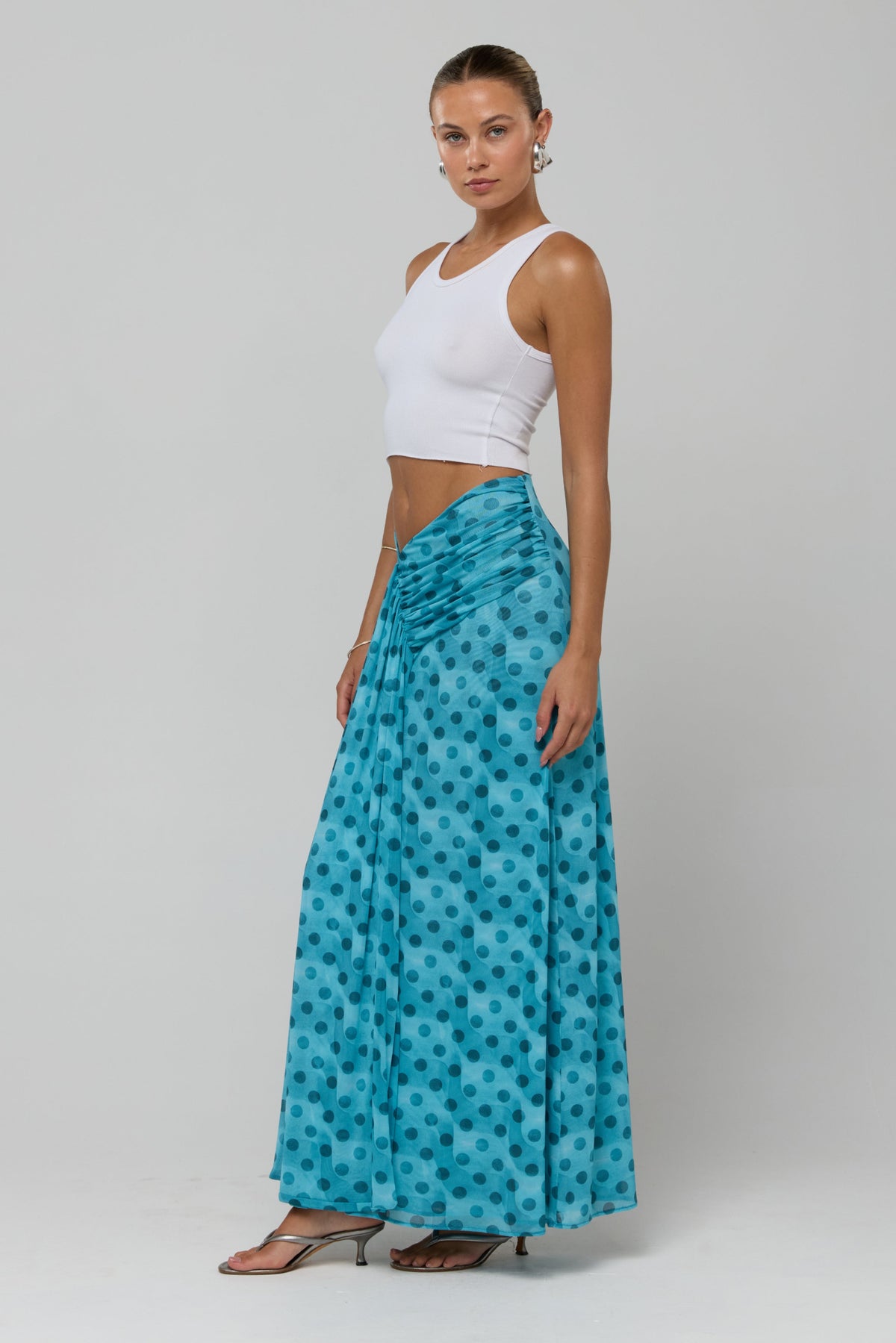 This is an image of Estelle in Aquamarine - RESA featuring a model wearing the dress