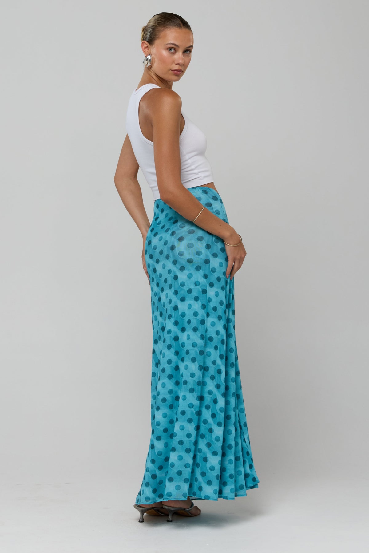 This is an image of Estelle in Aquamarine - RESA featuring a model wearing the dress