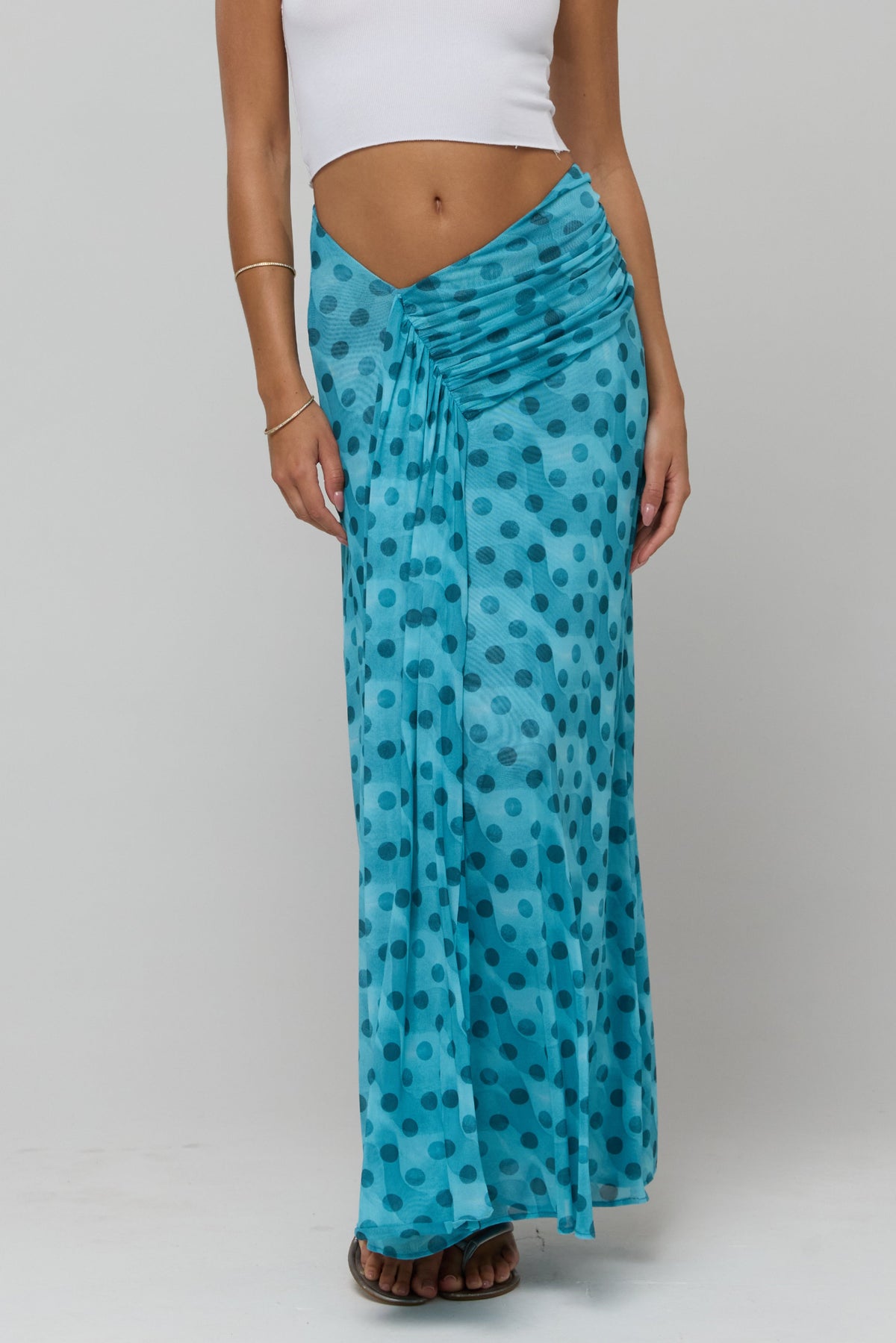 This is an image of Estelle in Aquamarine - RESA featuring a model wearing the dress