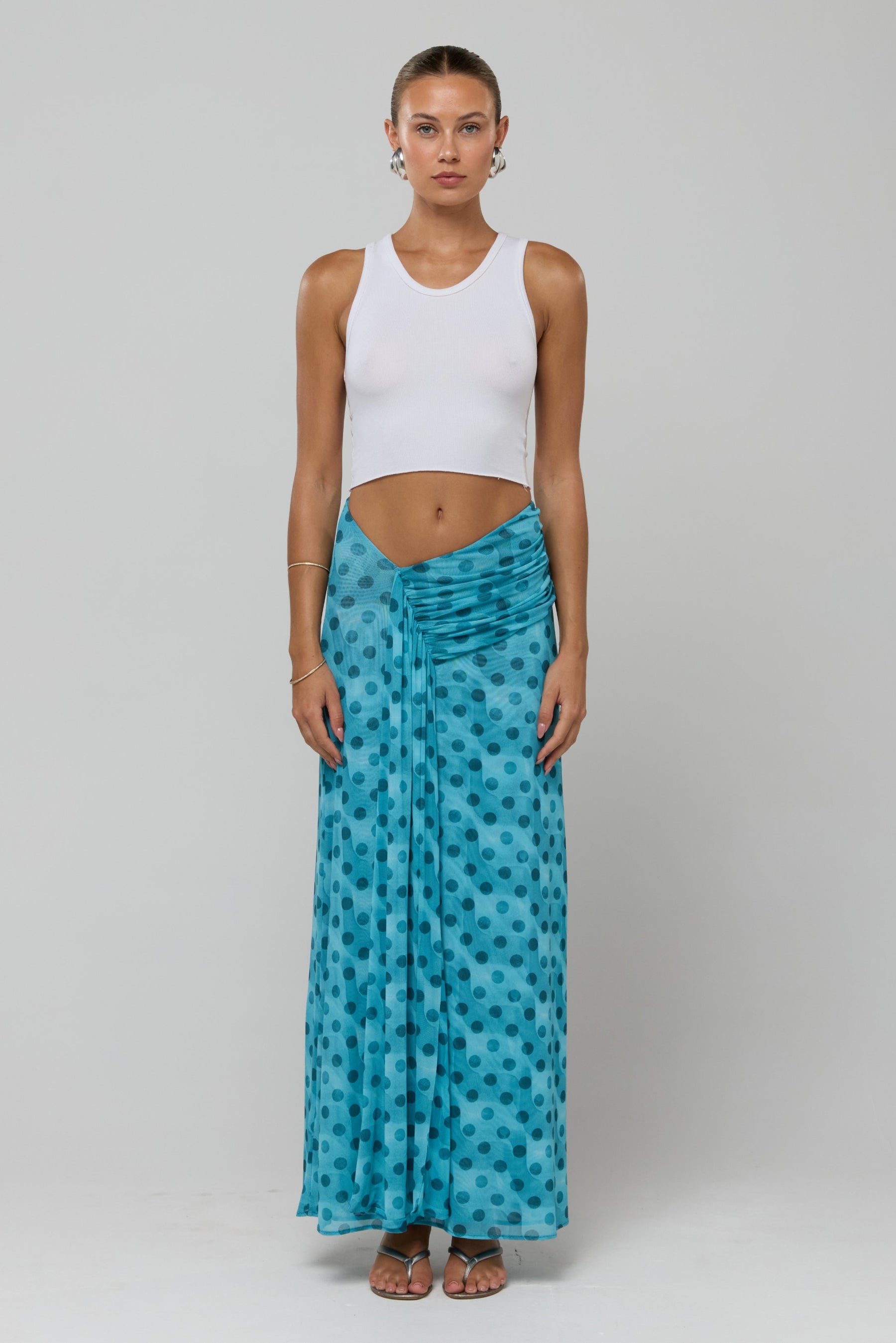 This is an image of Estelle in Aquamarine - RESA featuring a model wearing the dress