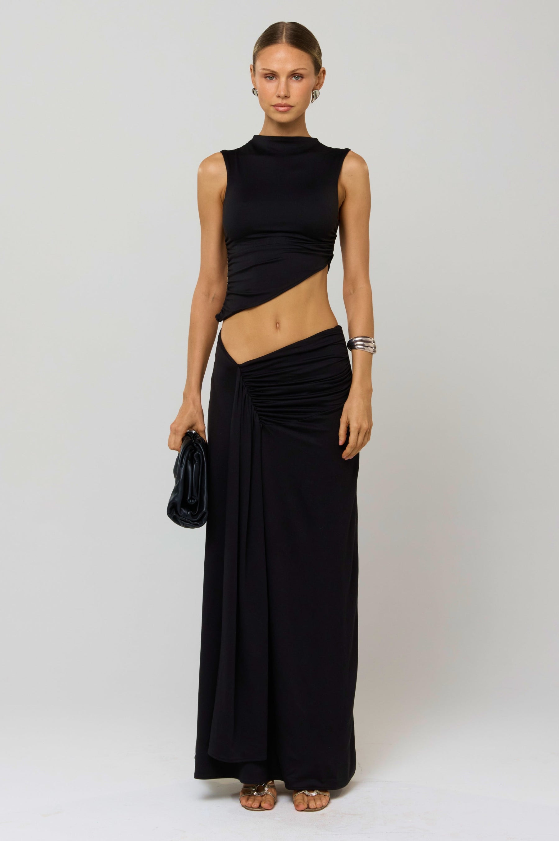 This is an image of Estelle Skirt in Black Knit - RESA featuring a model wearing the dress